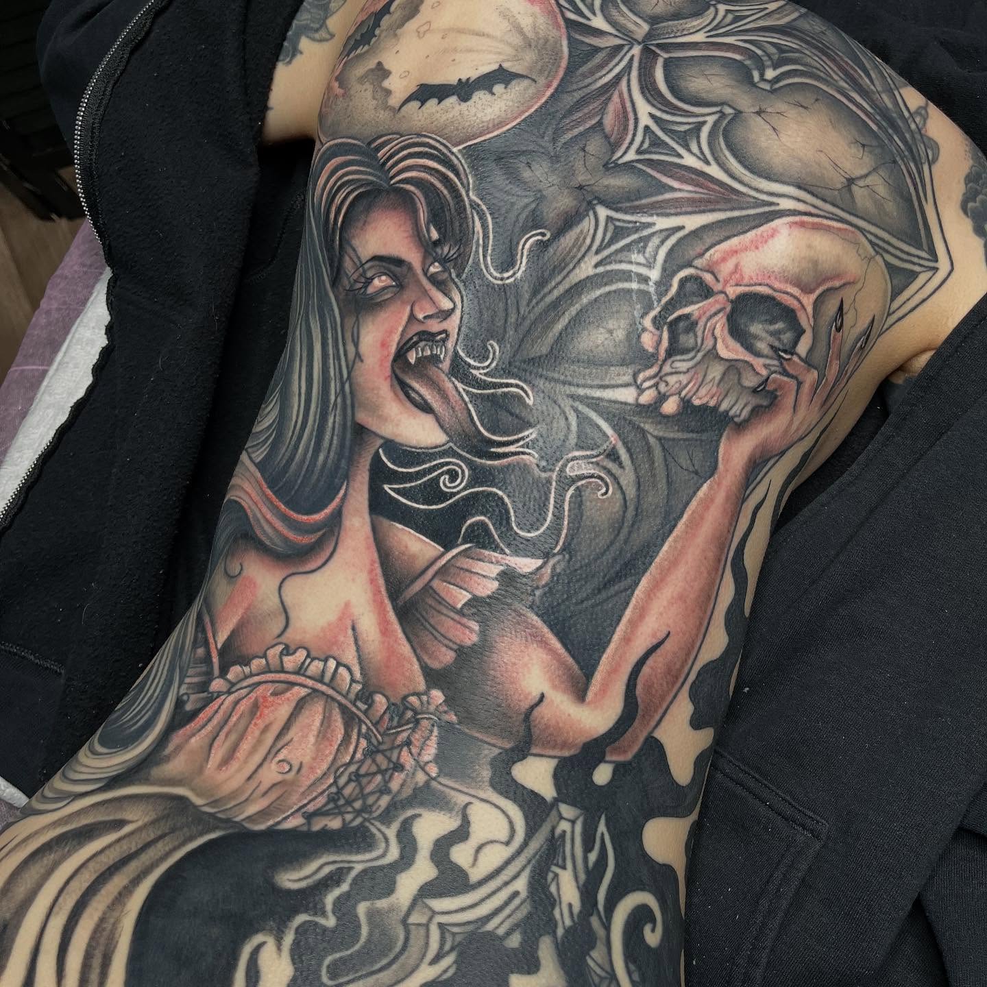Woman with skull dark realism tattoo on the shoulder by Michigan Tattoo Artist - Nadia Garver, Clinton Township, Michigan