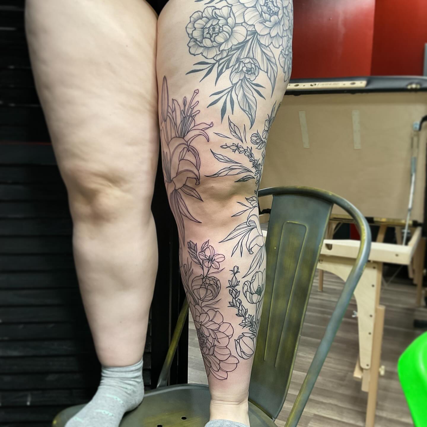 Floral arrangement black and grey tattoo on the calf by Michigan Tattoo Artist - Nadia Garver, Clinton Township, Michigan