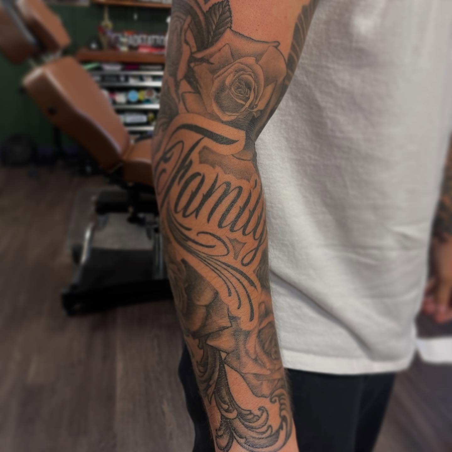 Family black and grey tattoo on the forearm by Jaxson Eugene Brady-Hobart
