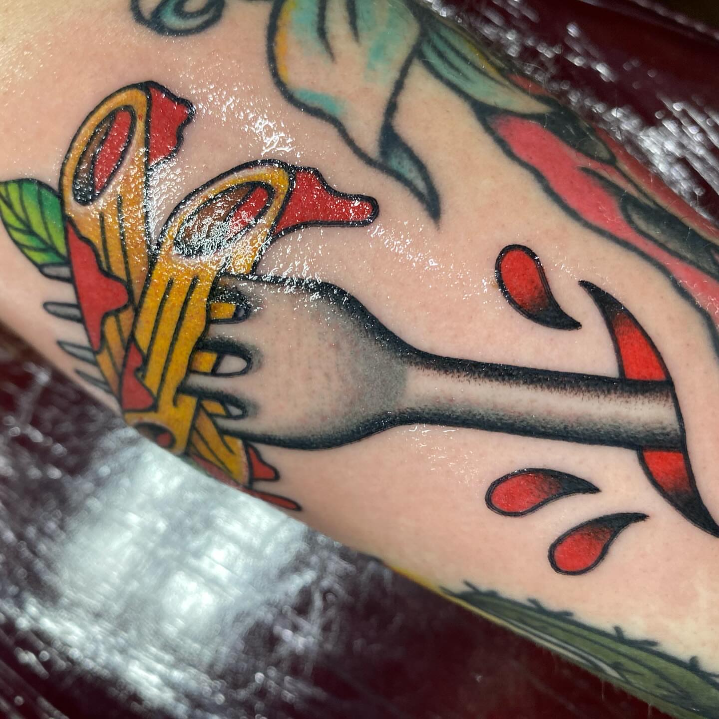 Fork and fries American traditional tattoo on the forearm by Chelstine, Encinitas, California
