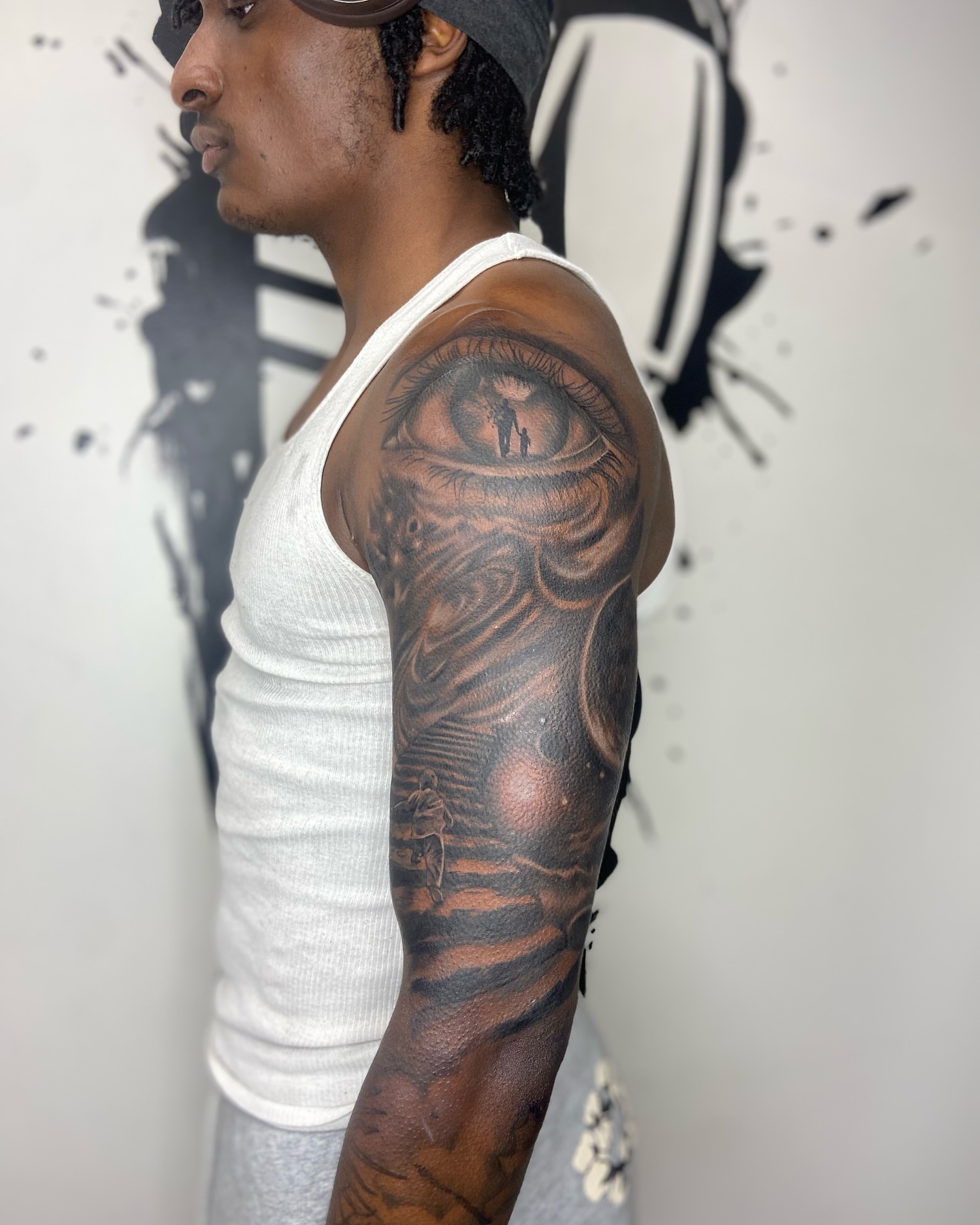 Eye realism tattoo on the upper arm by Chicago Tattoo Artist