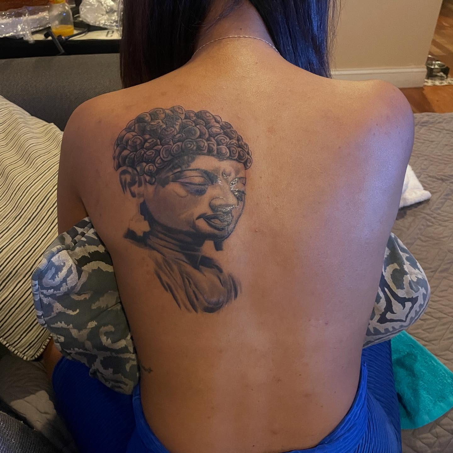 Buddha head black and grey tattoo on the back by Comic-Book-M πͺβπ½π₯
