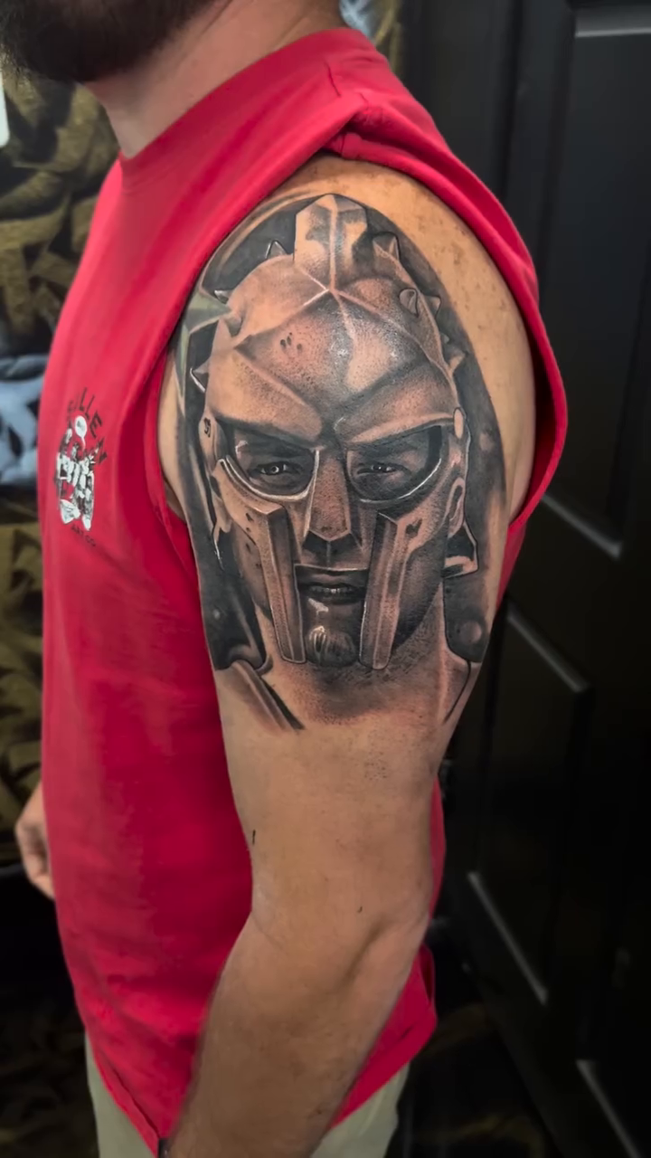 Spartan helmet realism tattoo by Fernando Luna