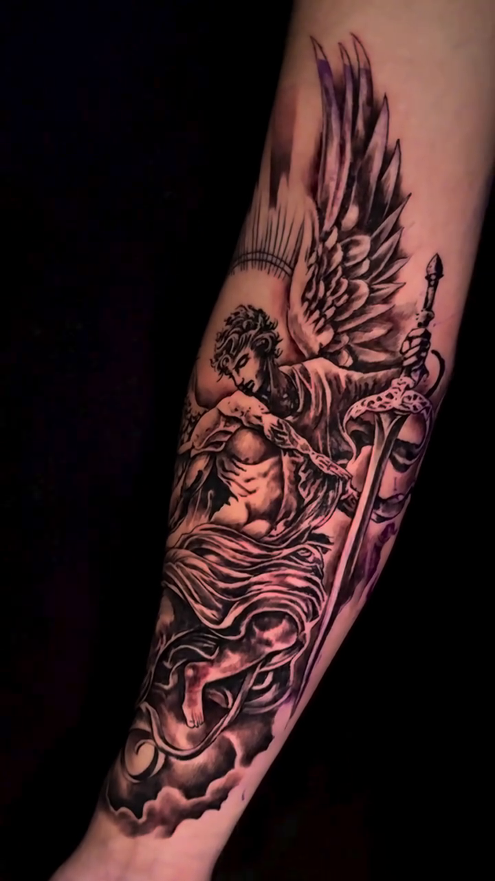 Angel with sword and sun realism tattoo by Sacramento Tattoo Artist Ryan