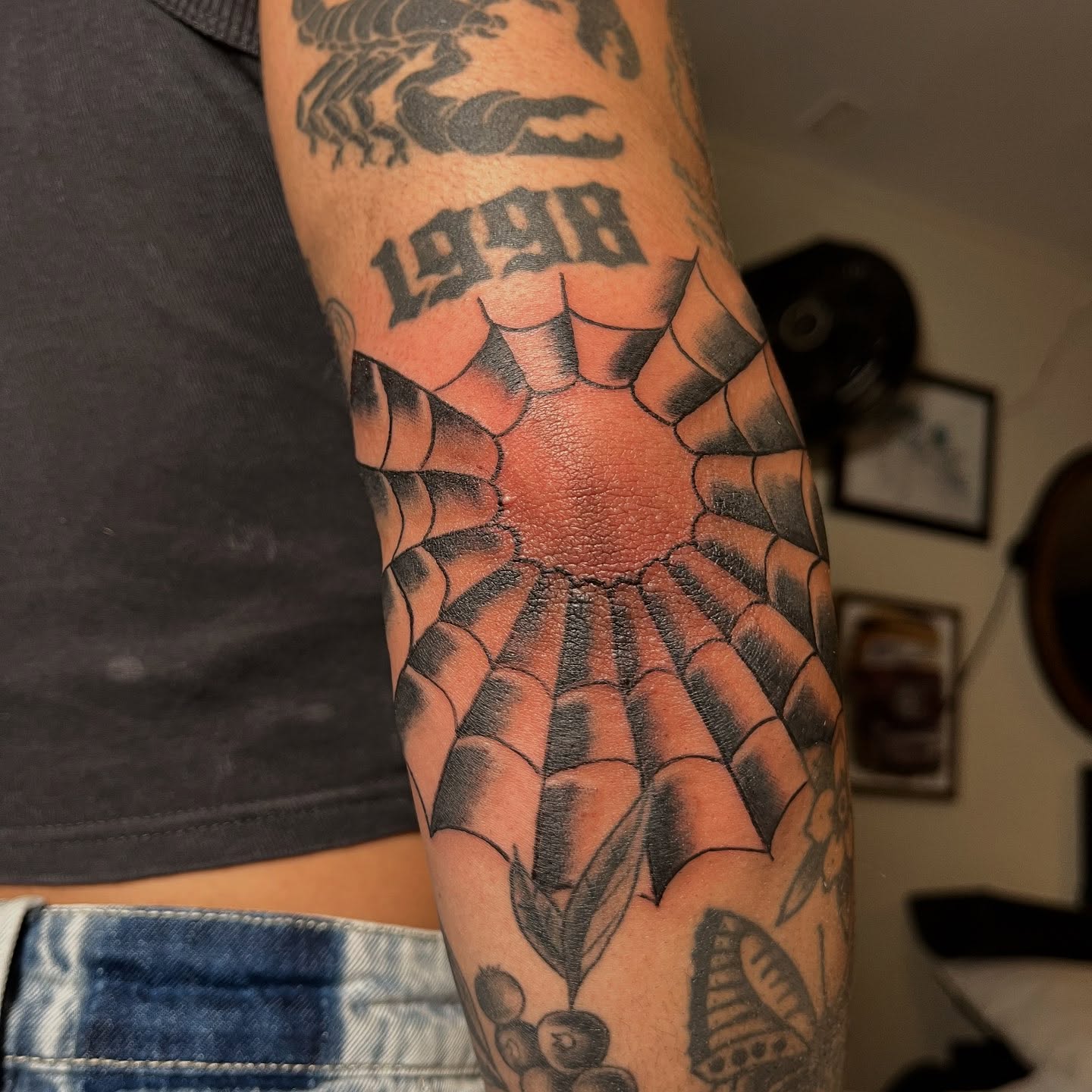Spiderweb black and grey tattoo on the forearm by San Diego tattoo artist