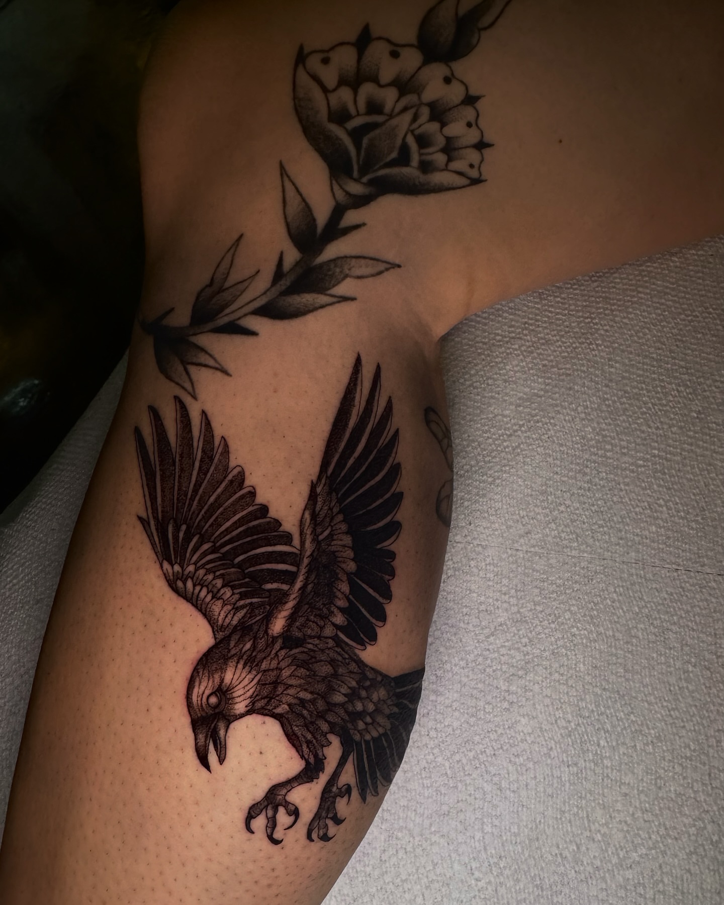 Raven and rose realism tattoo on the forearm by V