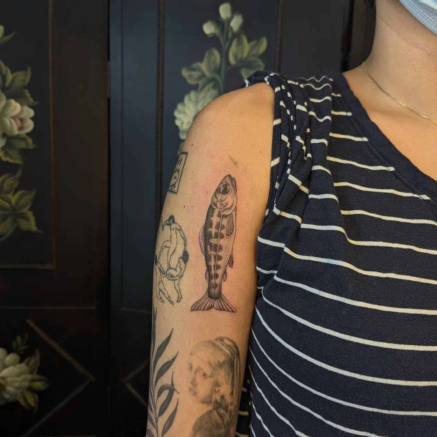 Fish black and grey tattoo on the upper arm by Jeanine, Providence, Rhode Island