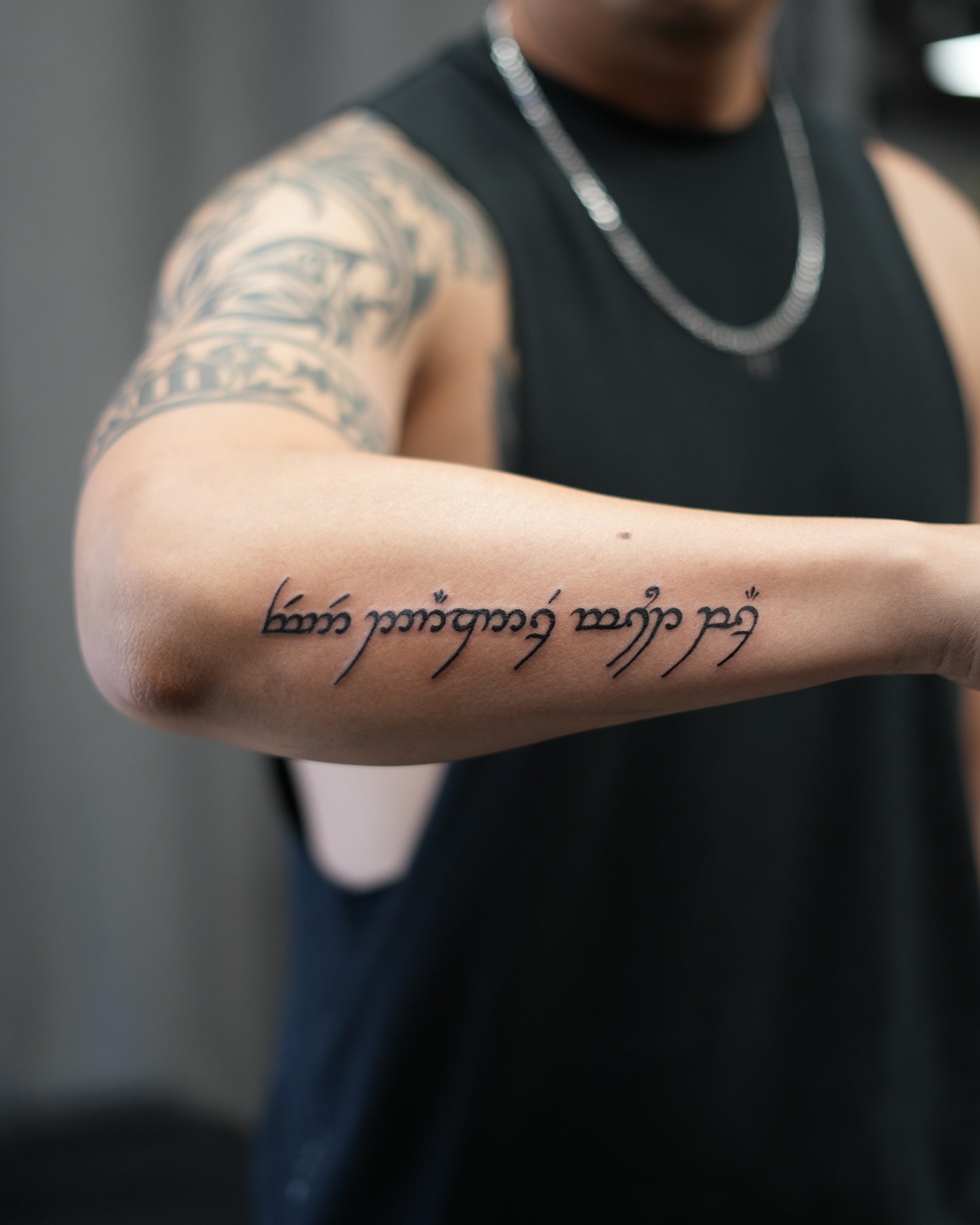 Elvish script lettering script tattoo on the forearm by alyssa ⋆₊ ♱