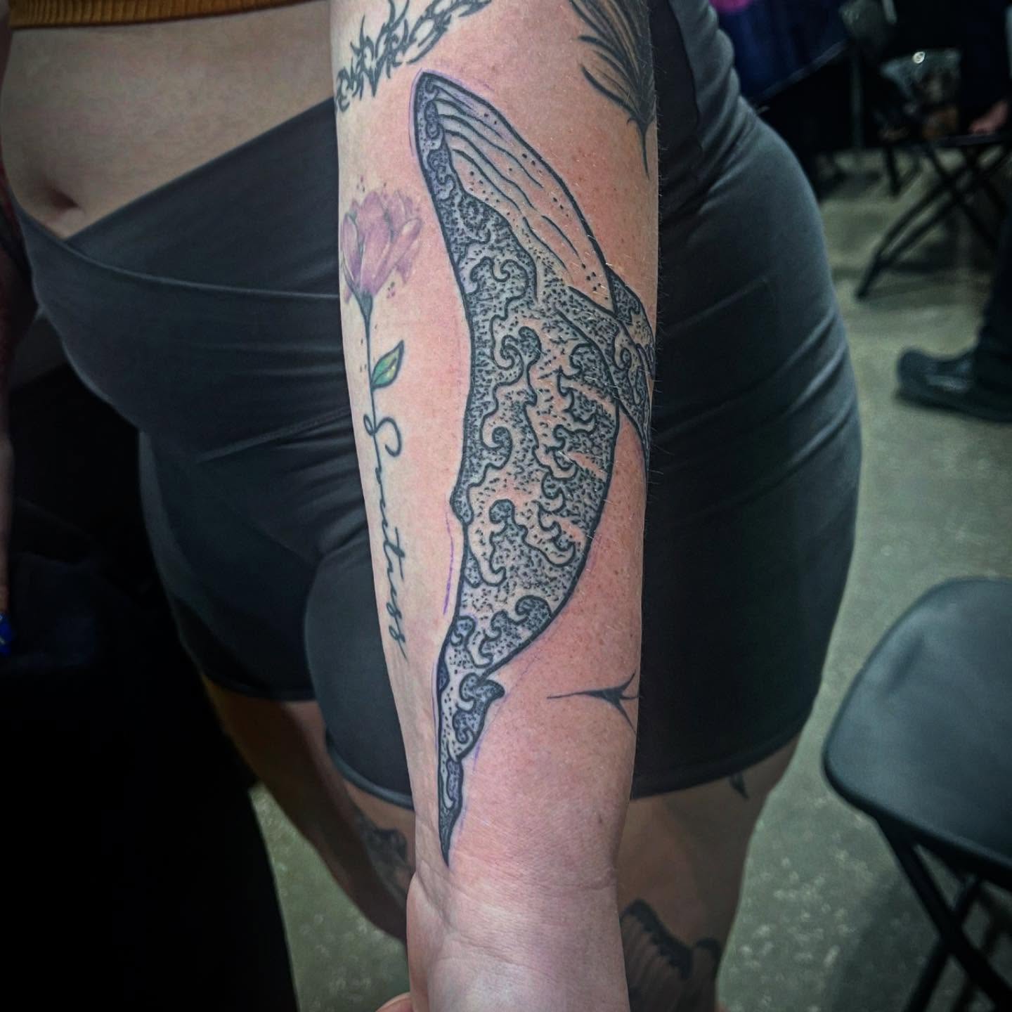 Whale tail dotwork tattoo on the forearm by Don Juan
