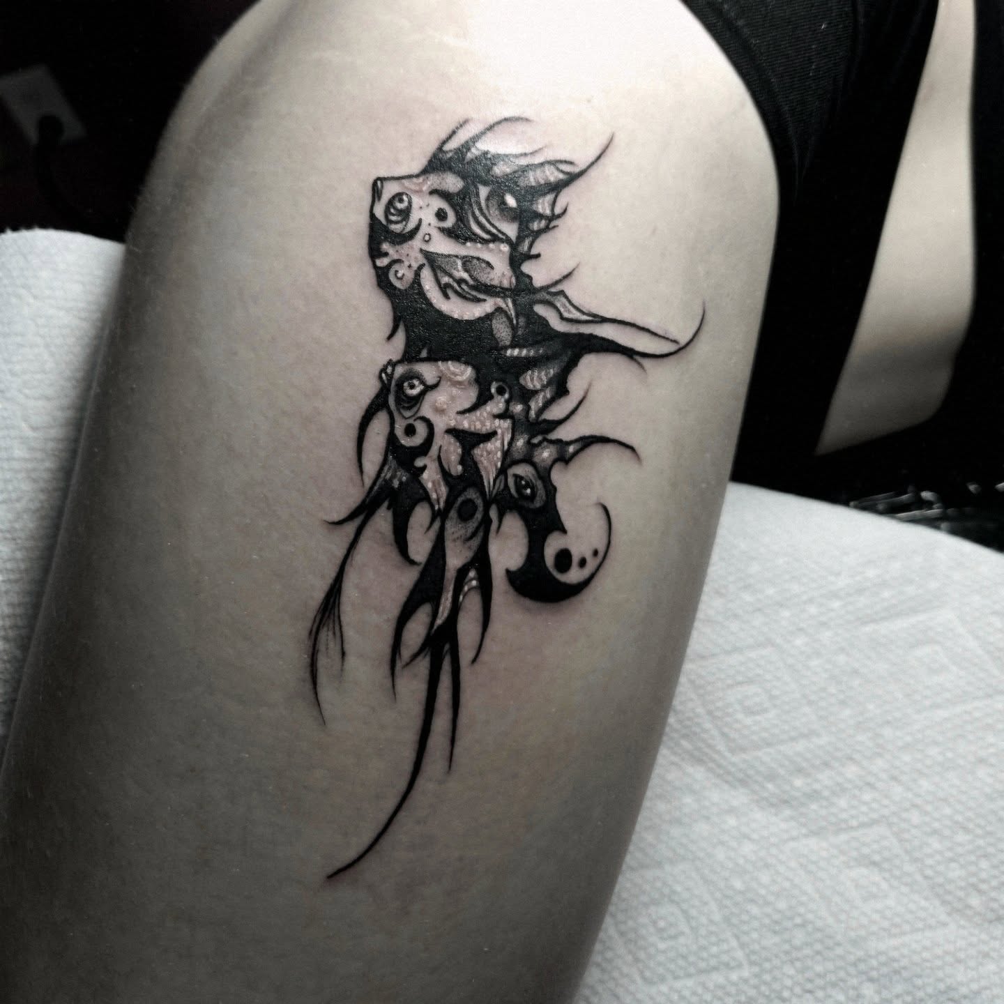Abstract creature surrealism tattoo on the thigh by Ema Fish