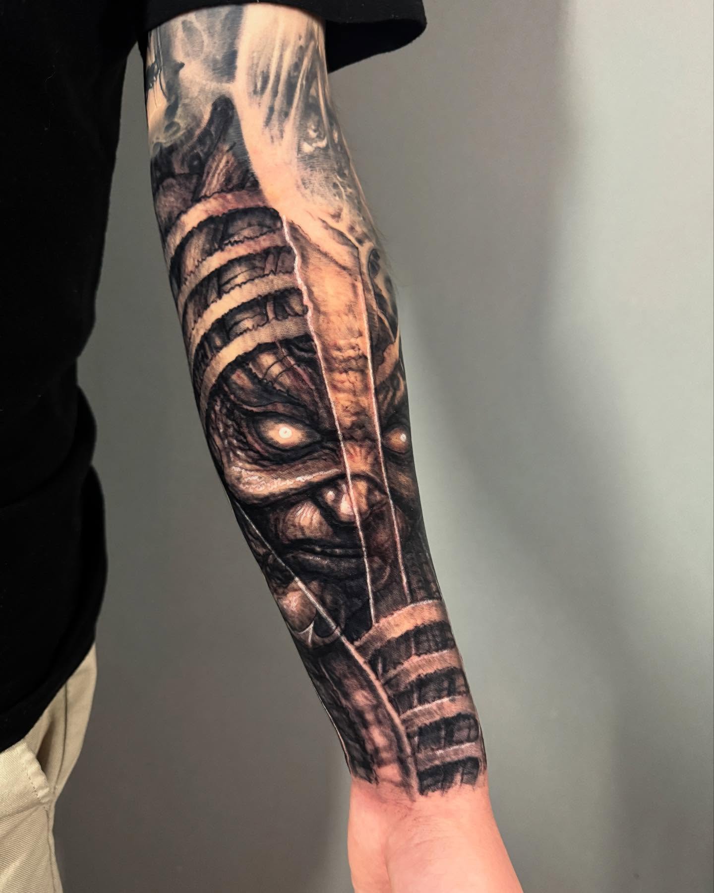 Mummy realism tattoo on the forearm by Paul Booth