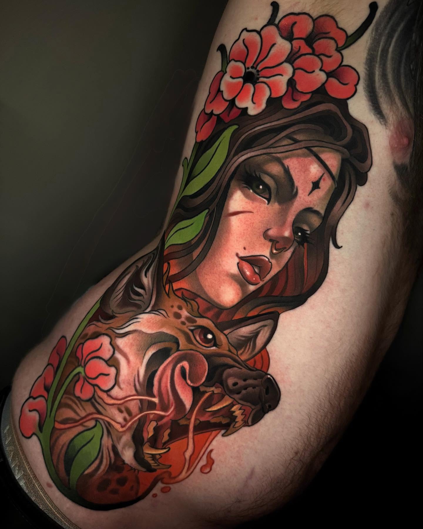 Woman with wolf American traditional tattoo on the thigh by Freddie Brown, Lombard, IL