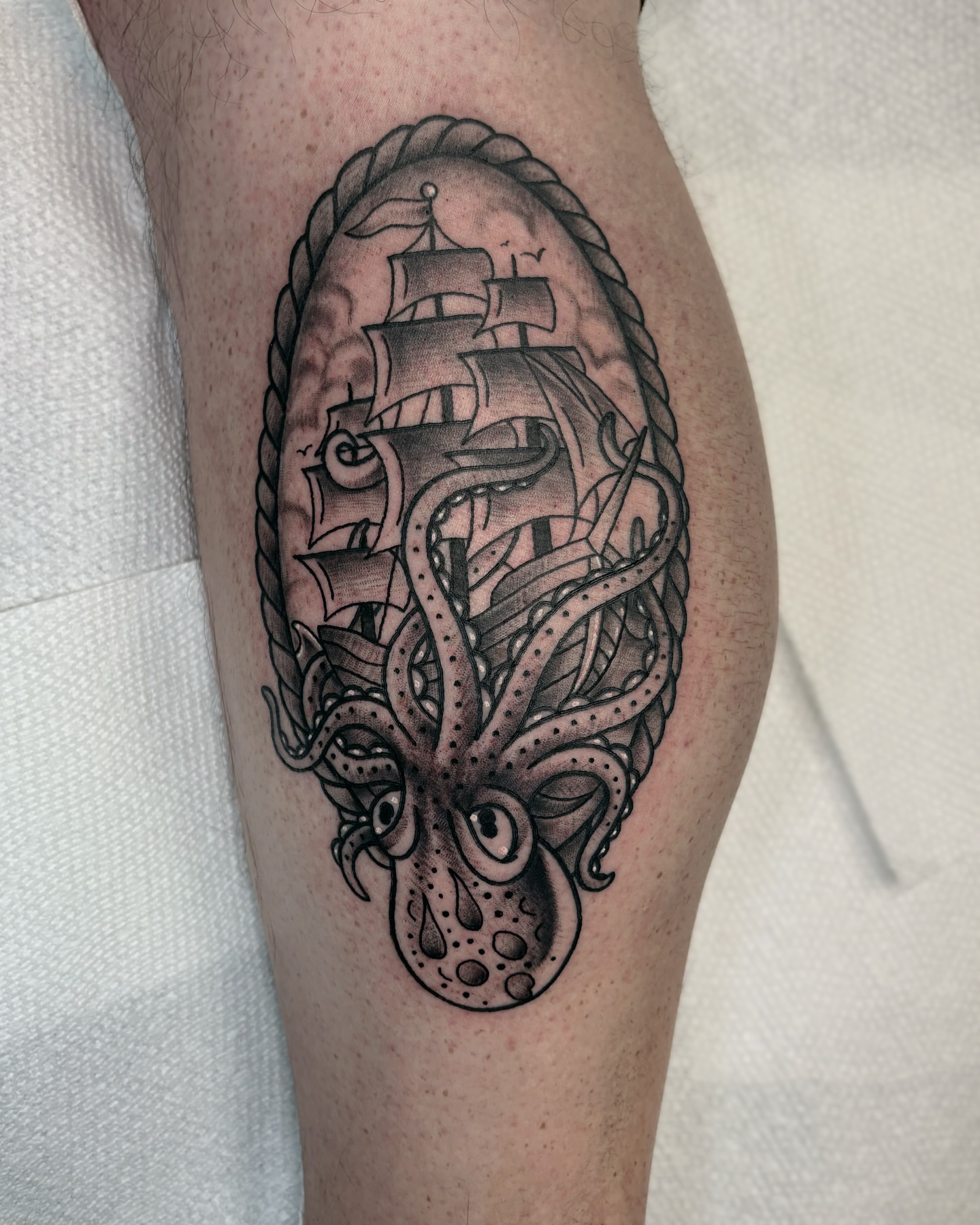 Ship and octopus realism tattoo on the forearm by Bunny Noel