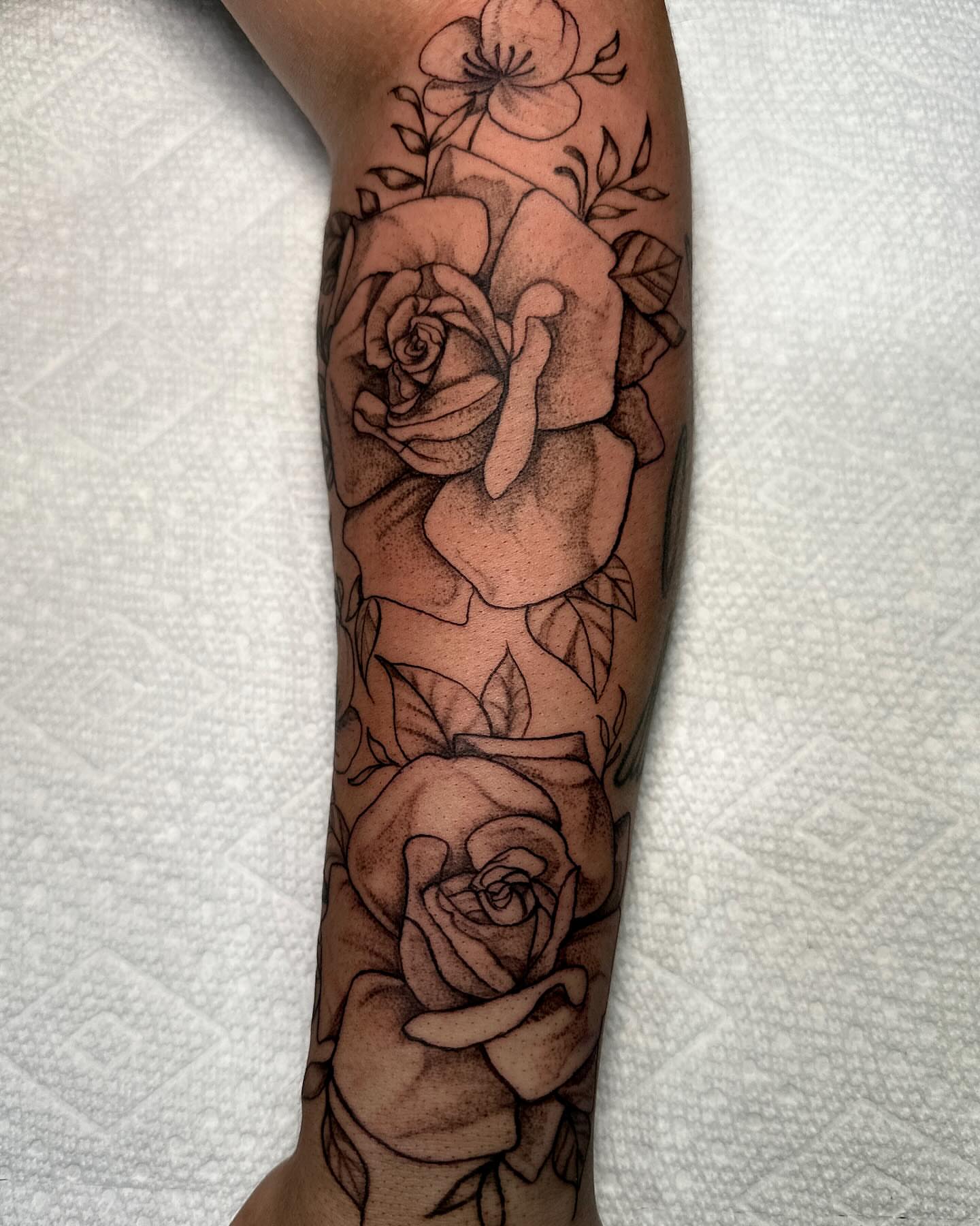 Roses dotwork tattoo on the forearm by Mika'la Berry