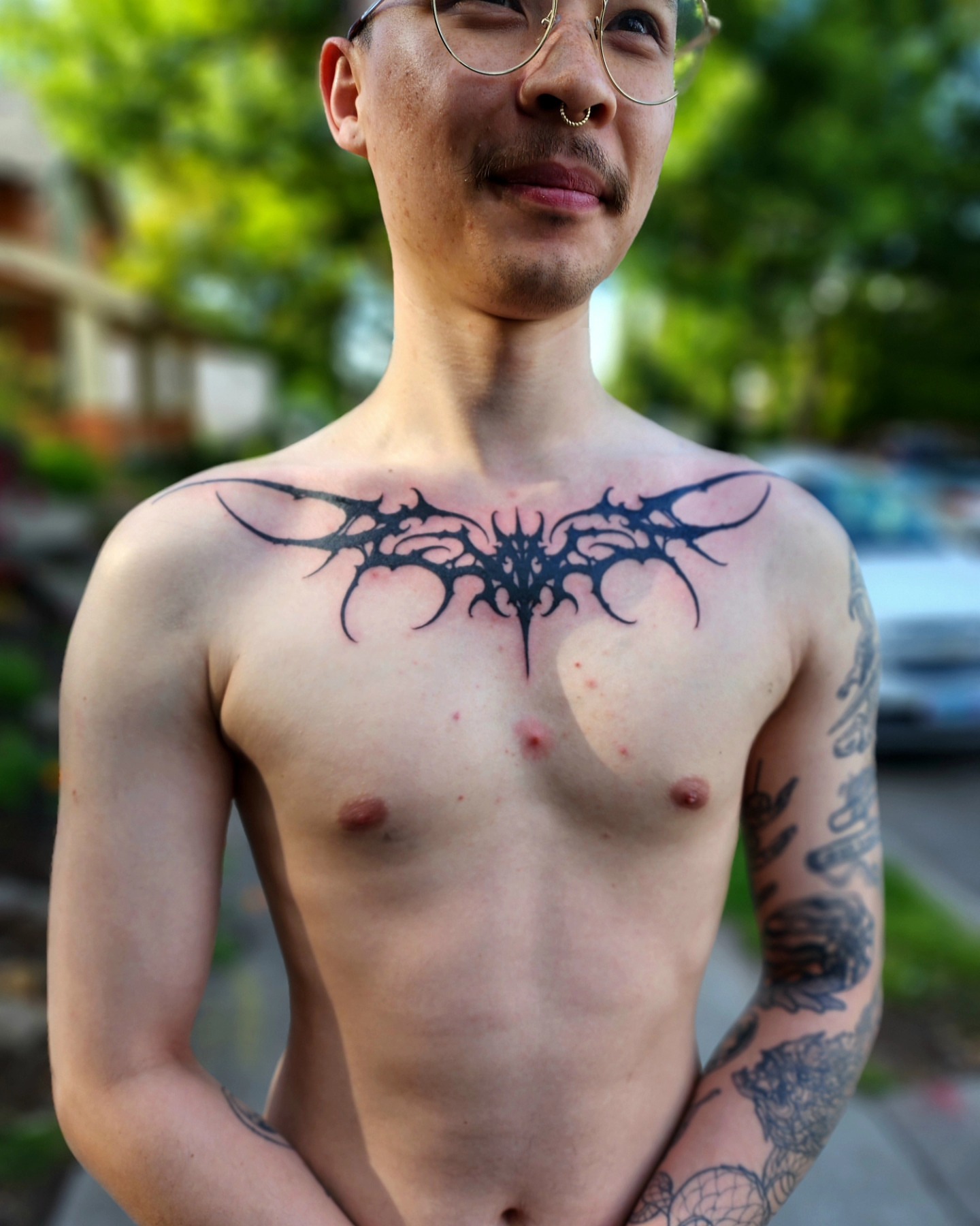 Bat tribal tattoo on the chest by @hellscribe