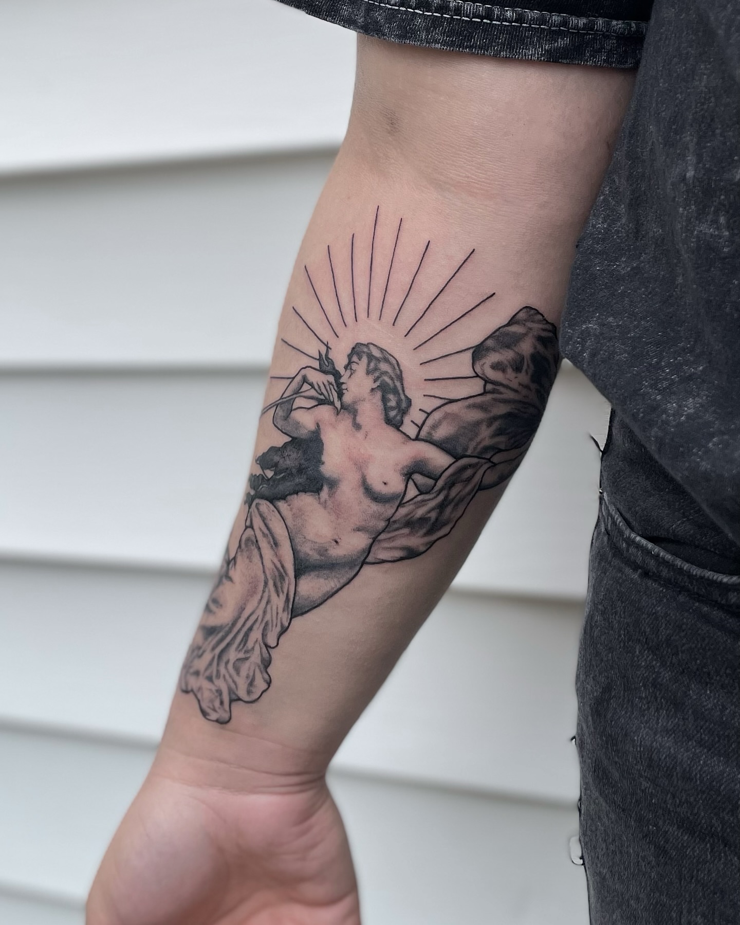 Nude female figure black and grey tattoo on the forearm by Liv