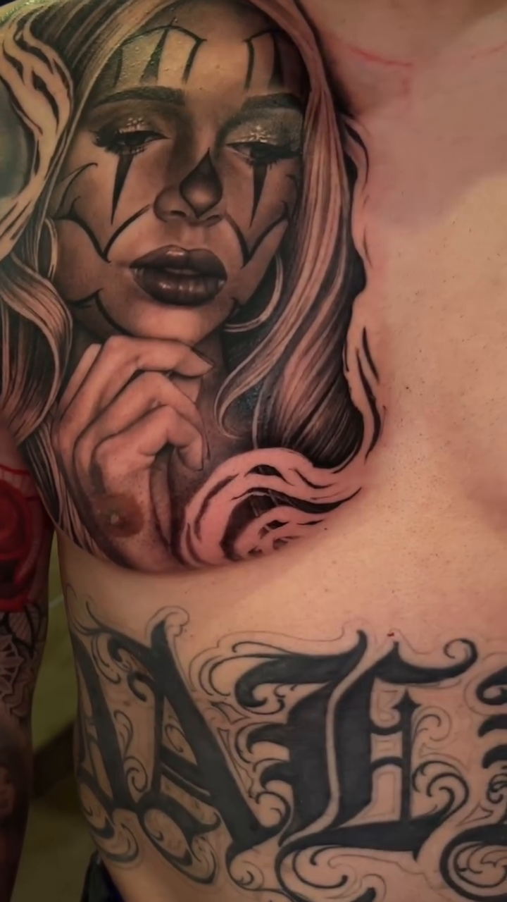 Woman with clown makeup Chicano tattoo by Richie Moreno lll