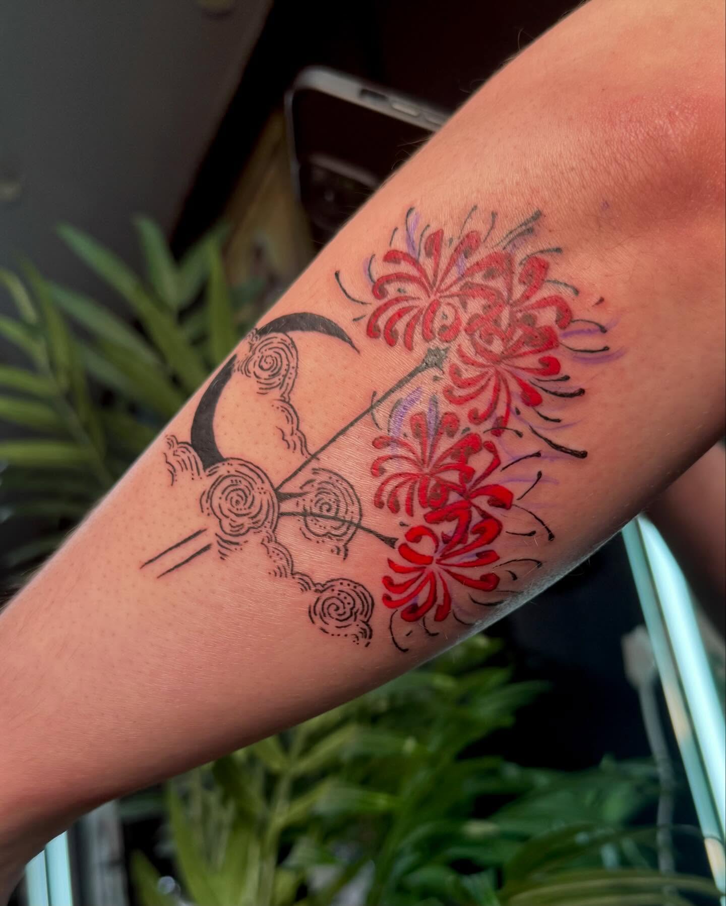 Chrysanthemums and swirls dotwork tattoo on the forearm by Nina Rush