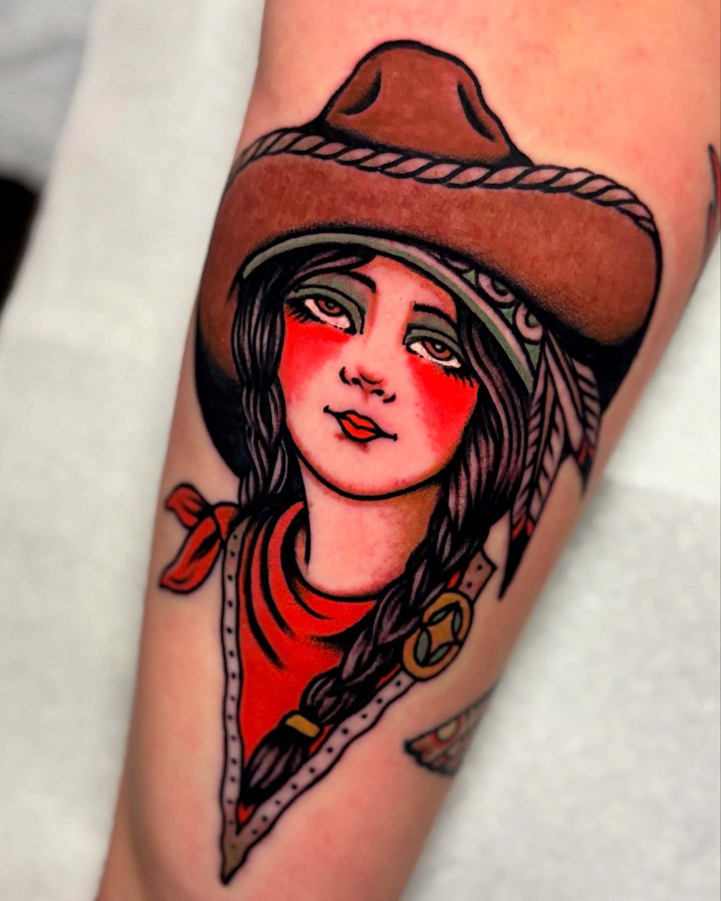 Cowgirl portrait American traditional tattoo on the forearm by Weston Imhoff