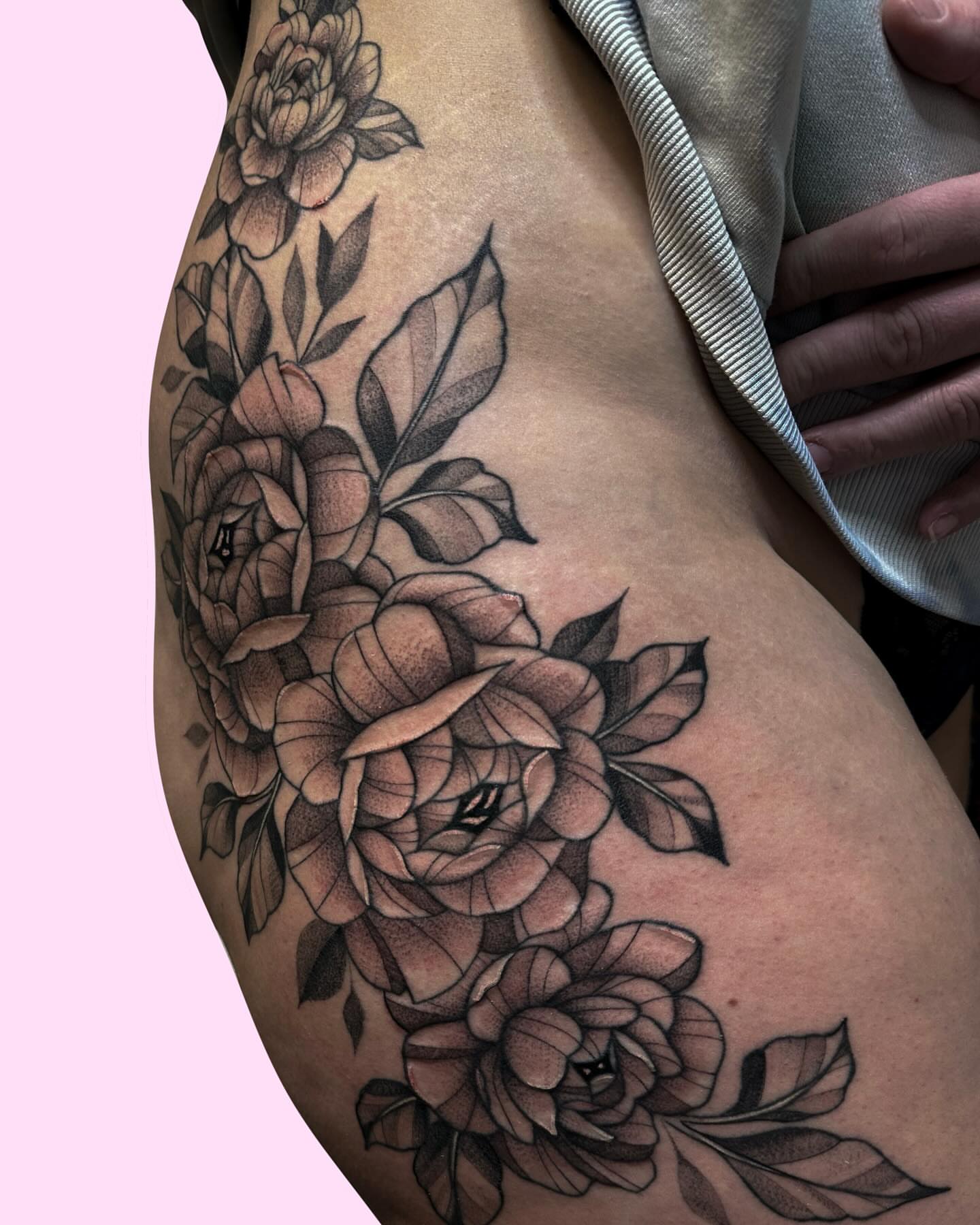 Roses dotwork tattoo on the thigh by Gabby Tolley🌛