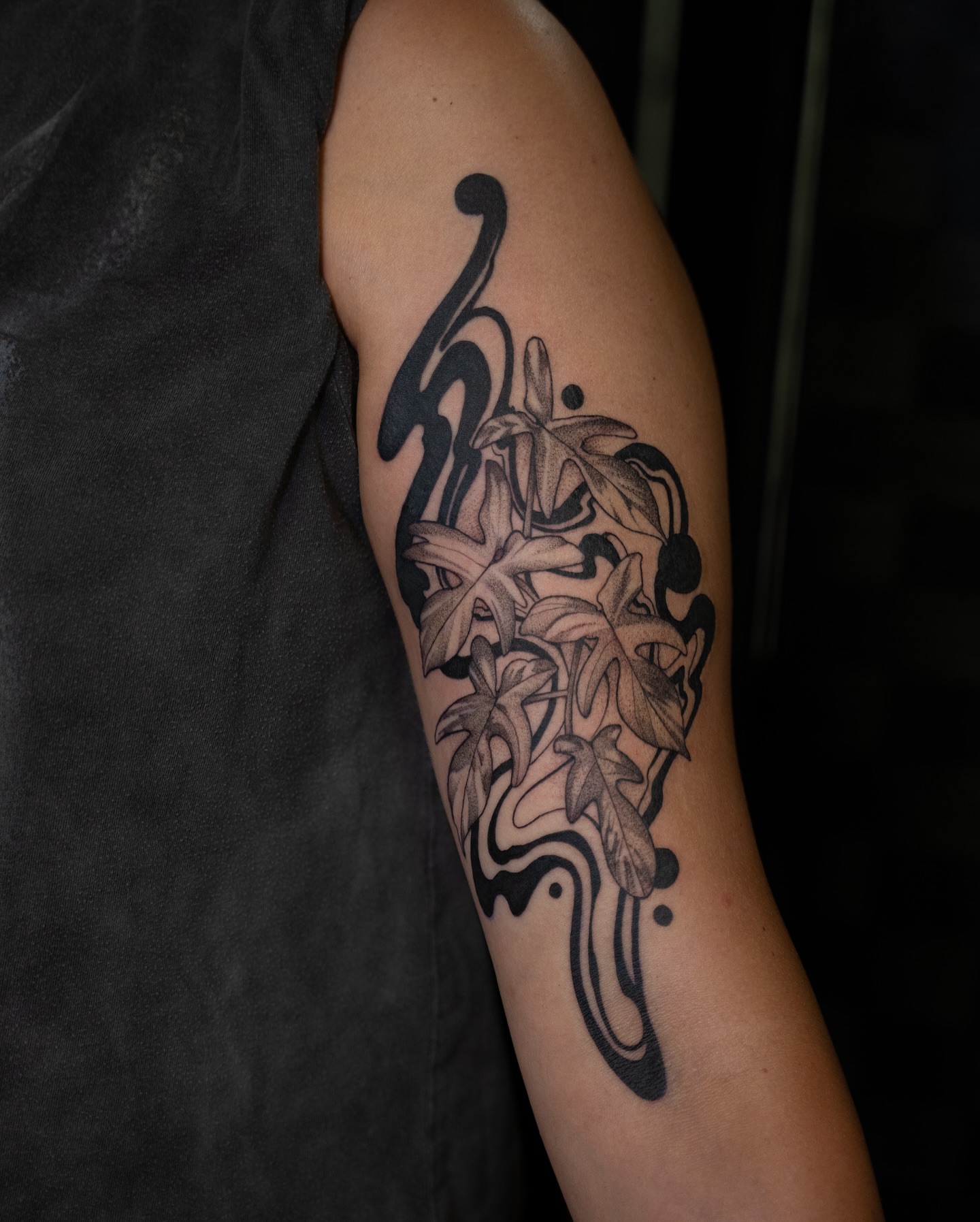Lilies black and grey tattoo on the forearm by Chris Estrada