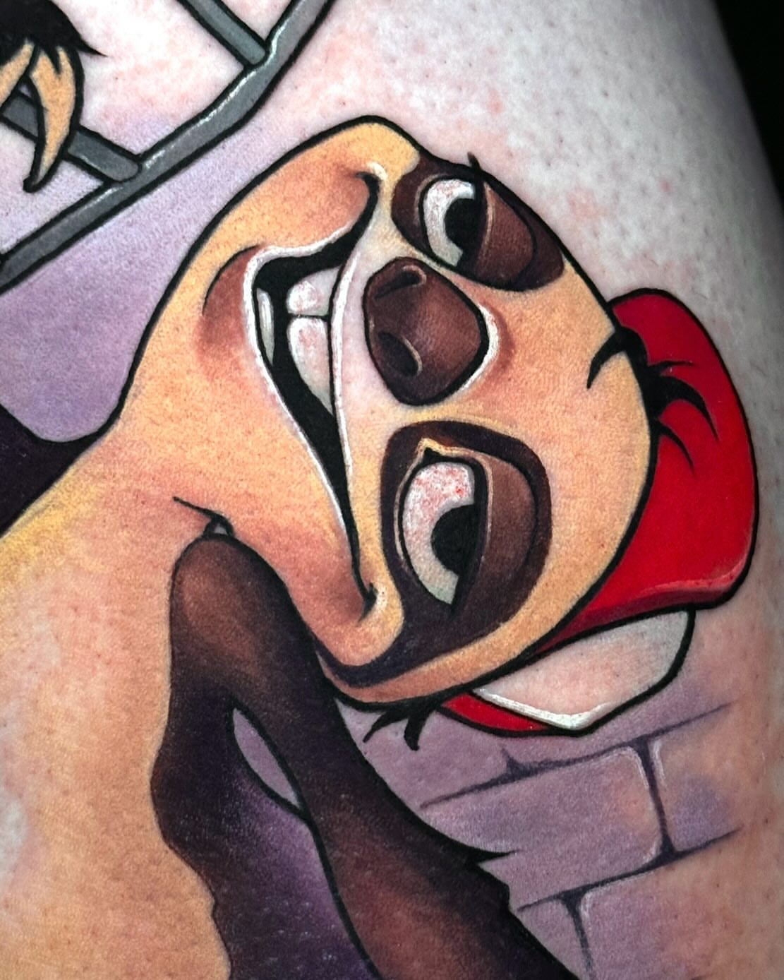 Angry clown American traditional tattoo on the thigh by Lena Aleksandrova