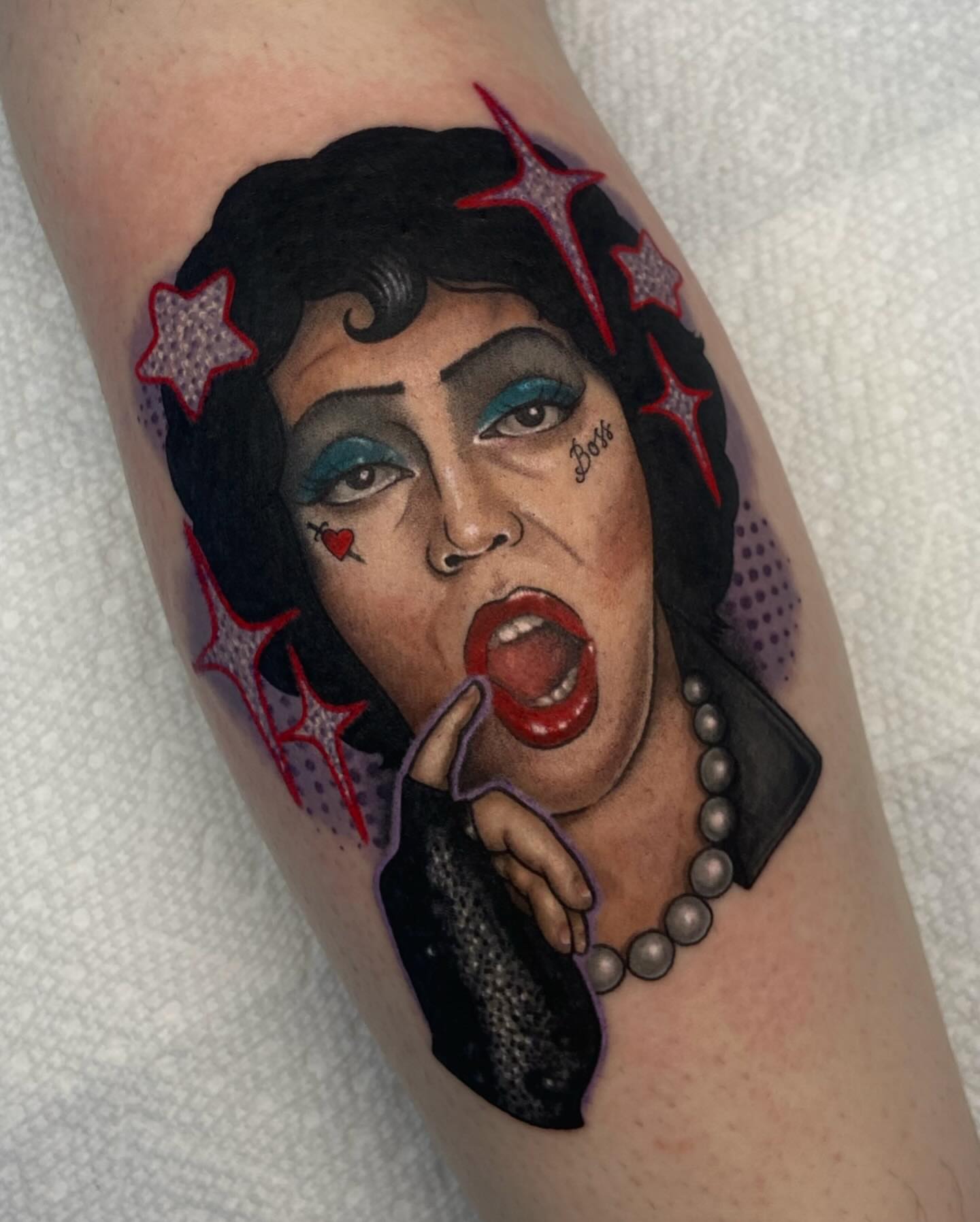Woman with exaggerated makeup American traditional tattoo on the forearm by ππππππ
