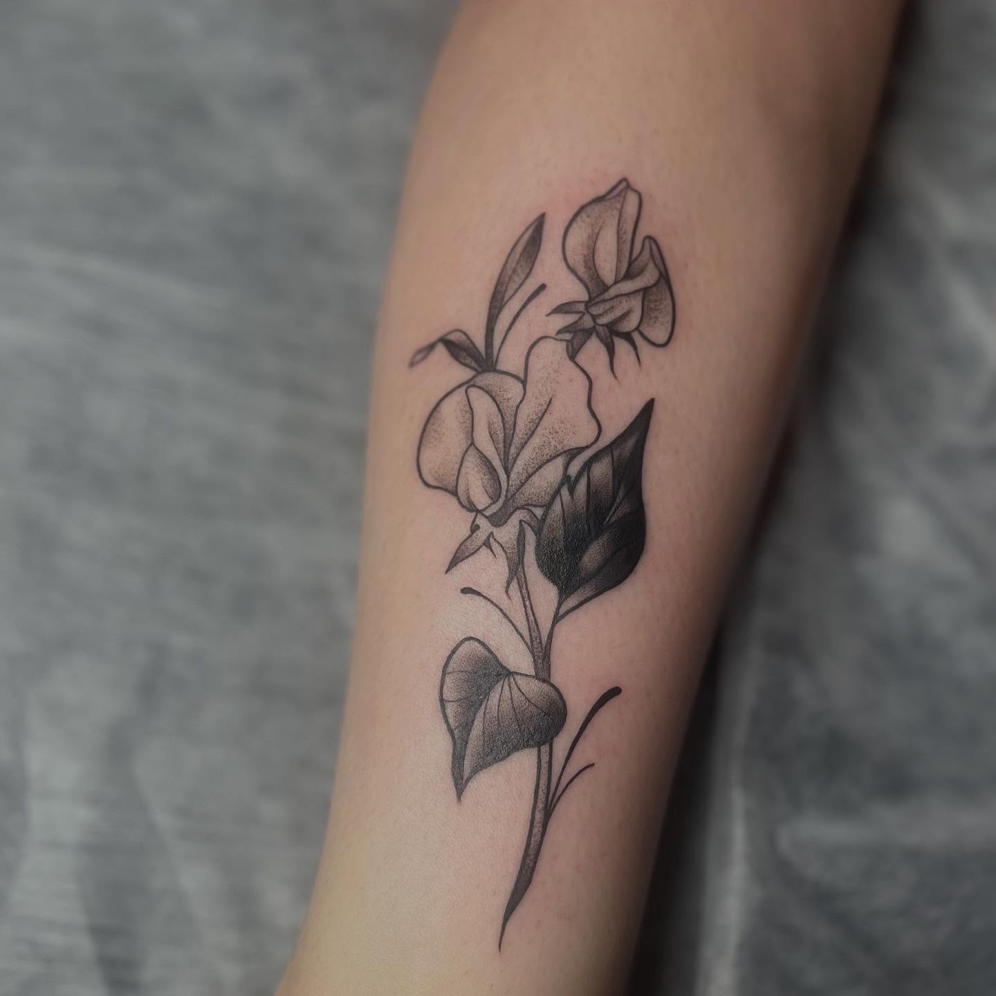 Flowers dotwork tattoo on the forearm by Lexi Ross