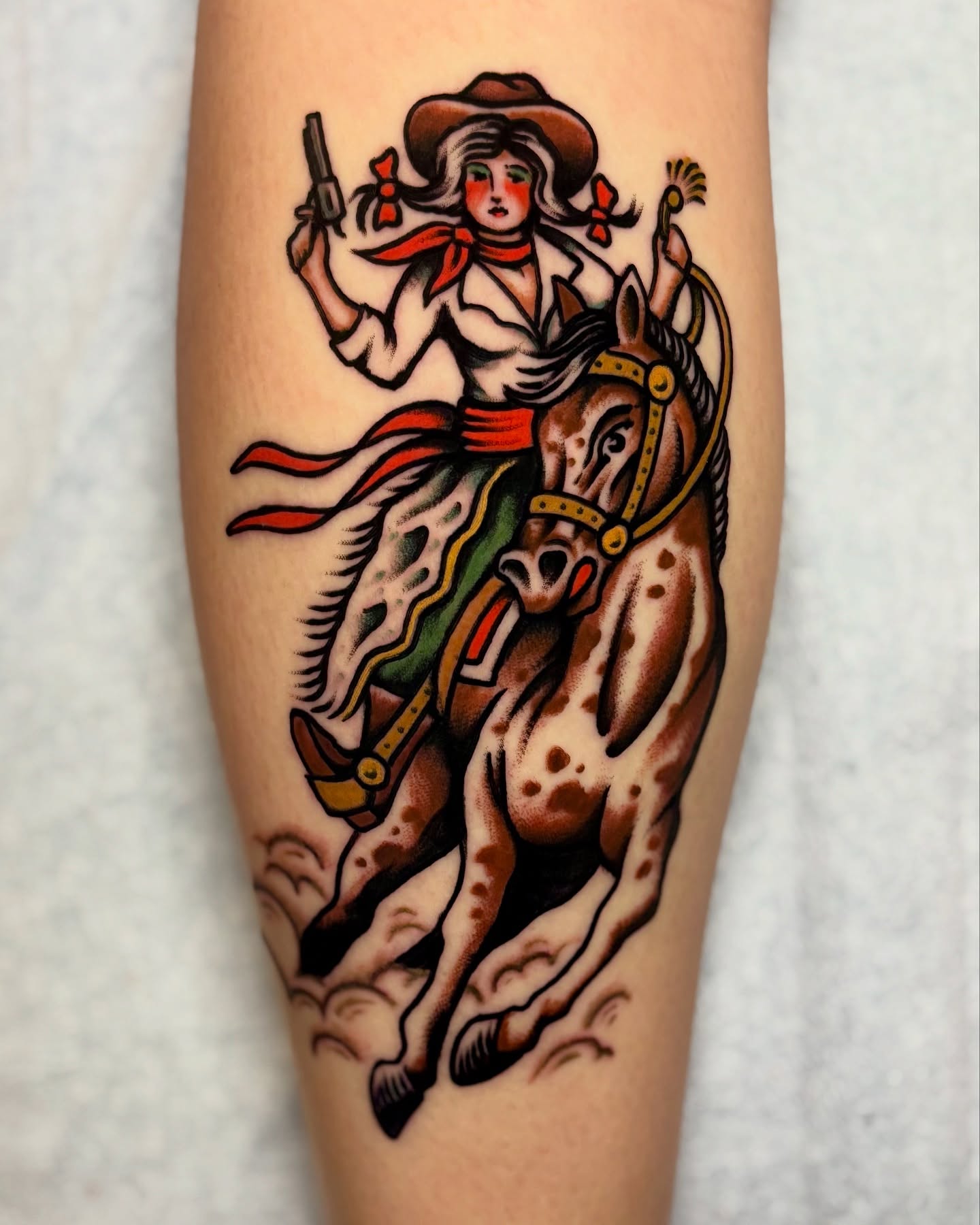 Cowgirl riding horse American traditional tattoo on the forearm by Weston Imhoff