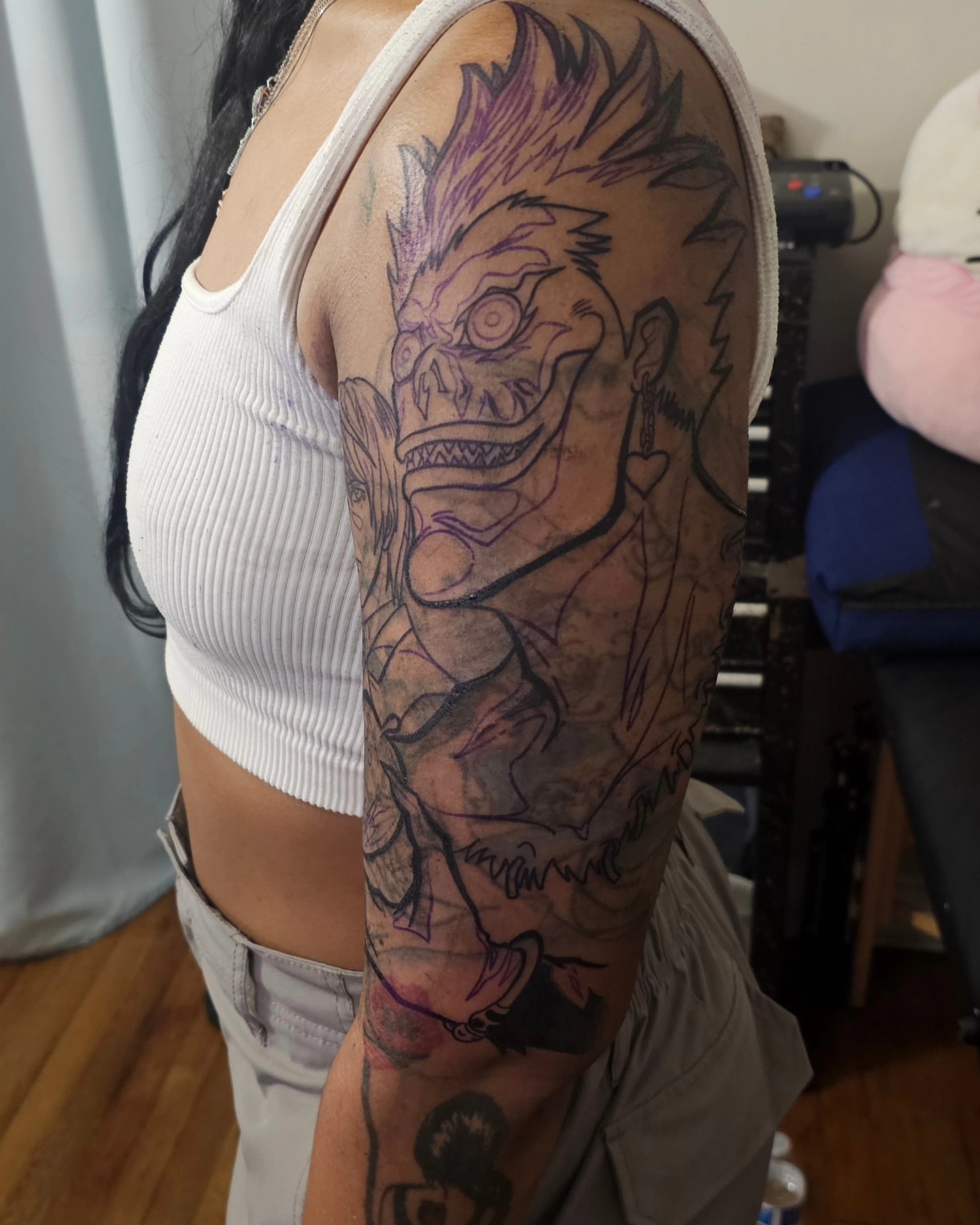 Demon dark realism tattoo on the upper arm by New York Tattoos Artist