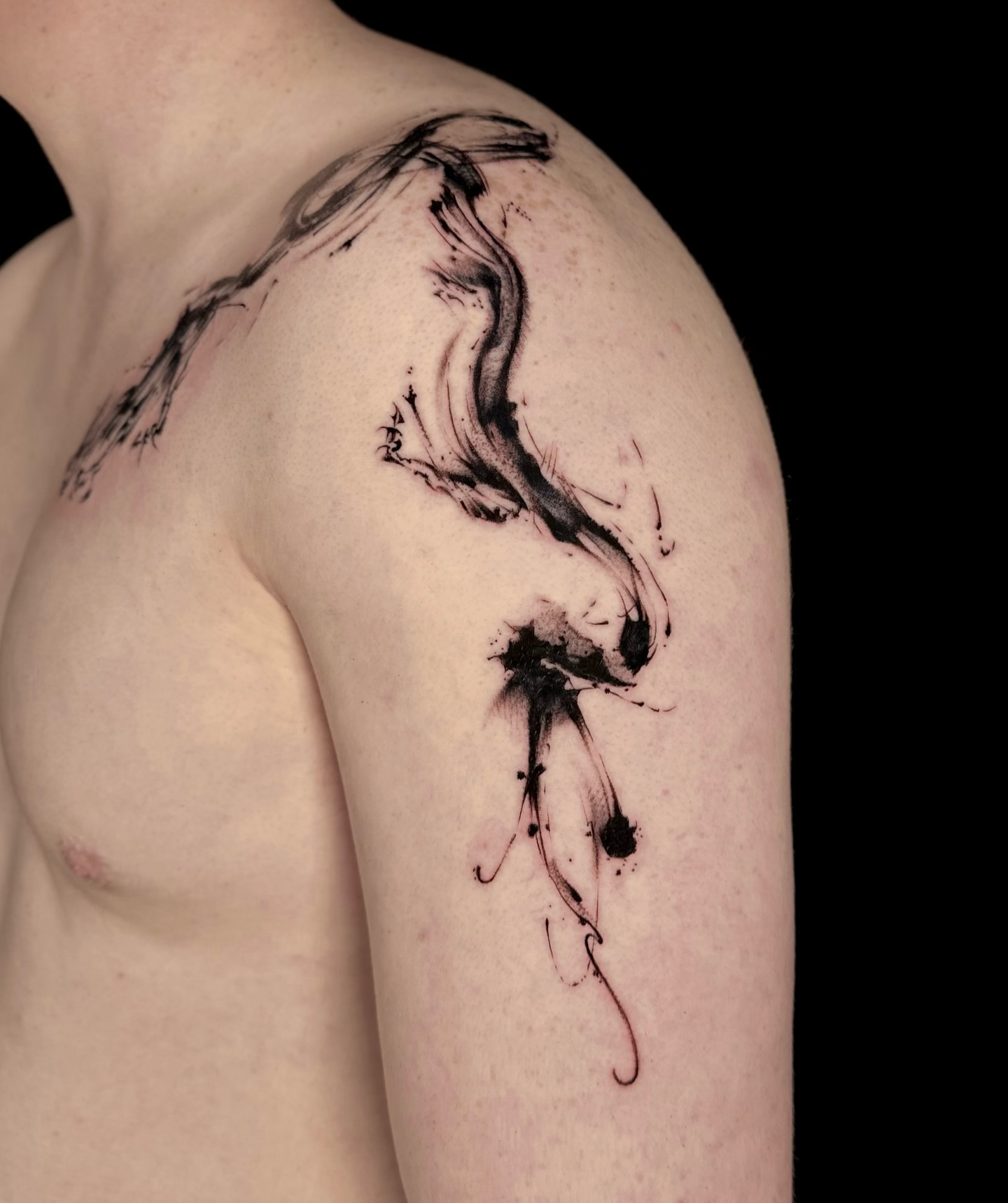Abstract swirl black and grey tattoo on the shoulder by Abi