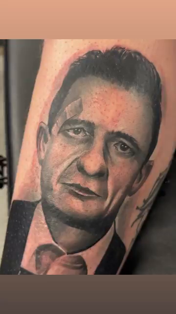 Johnny Cash portrait realism tattoo by Garrett Rautio
