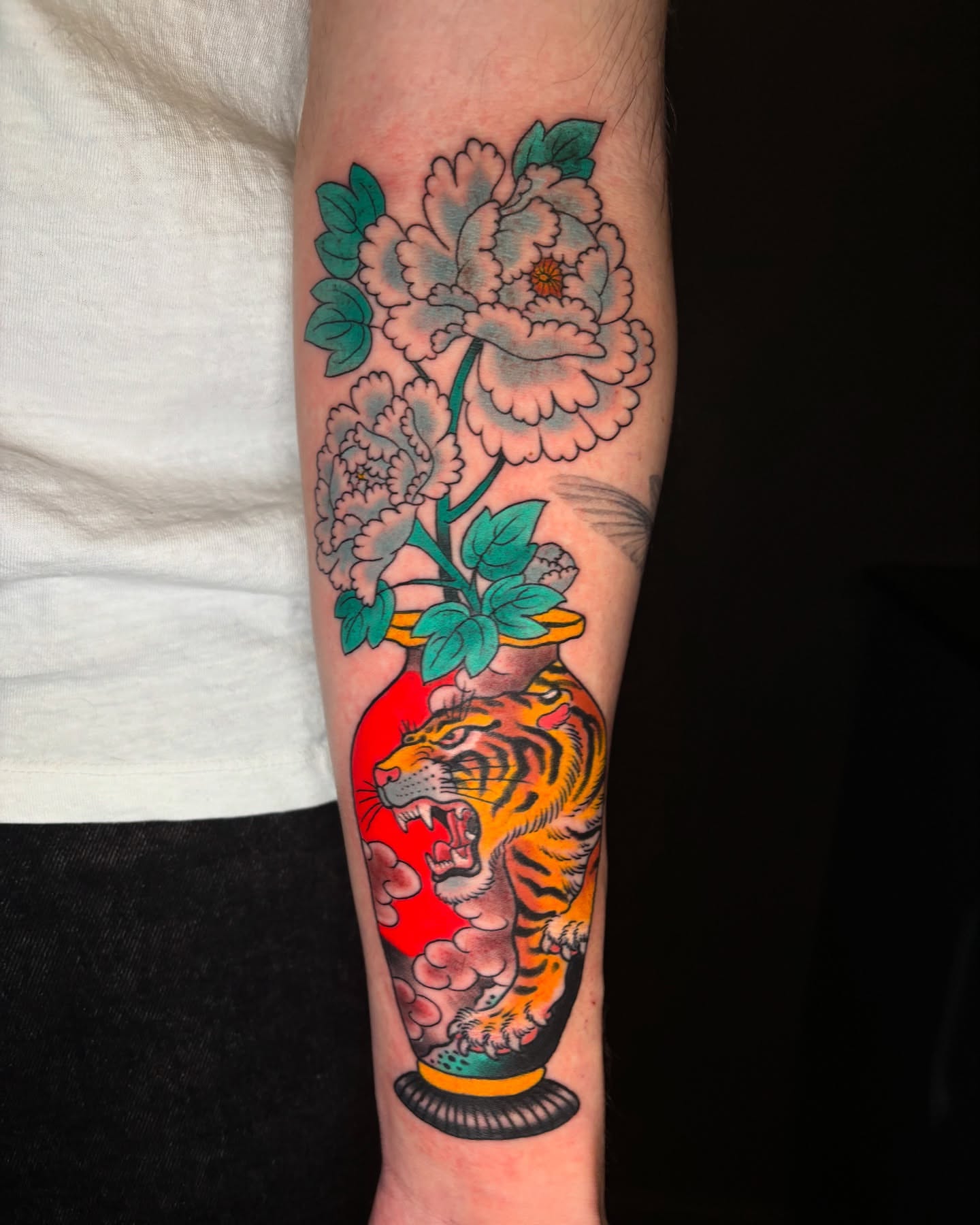 Peony and tiger American traditional tattoo on the forearm by Mike Maciejewski:Chicago Tattoo Artist