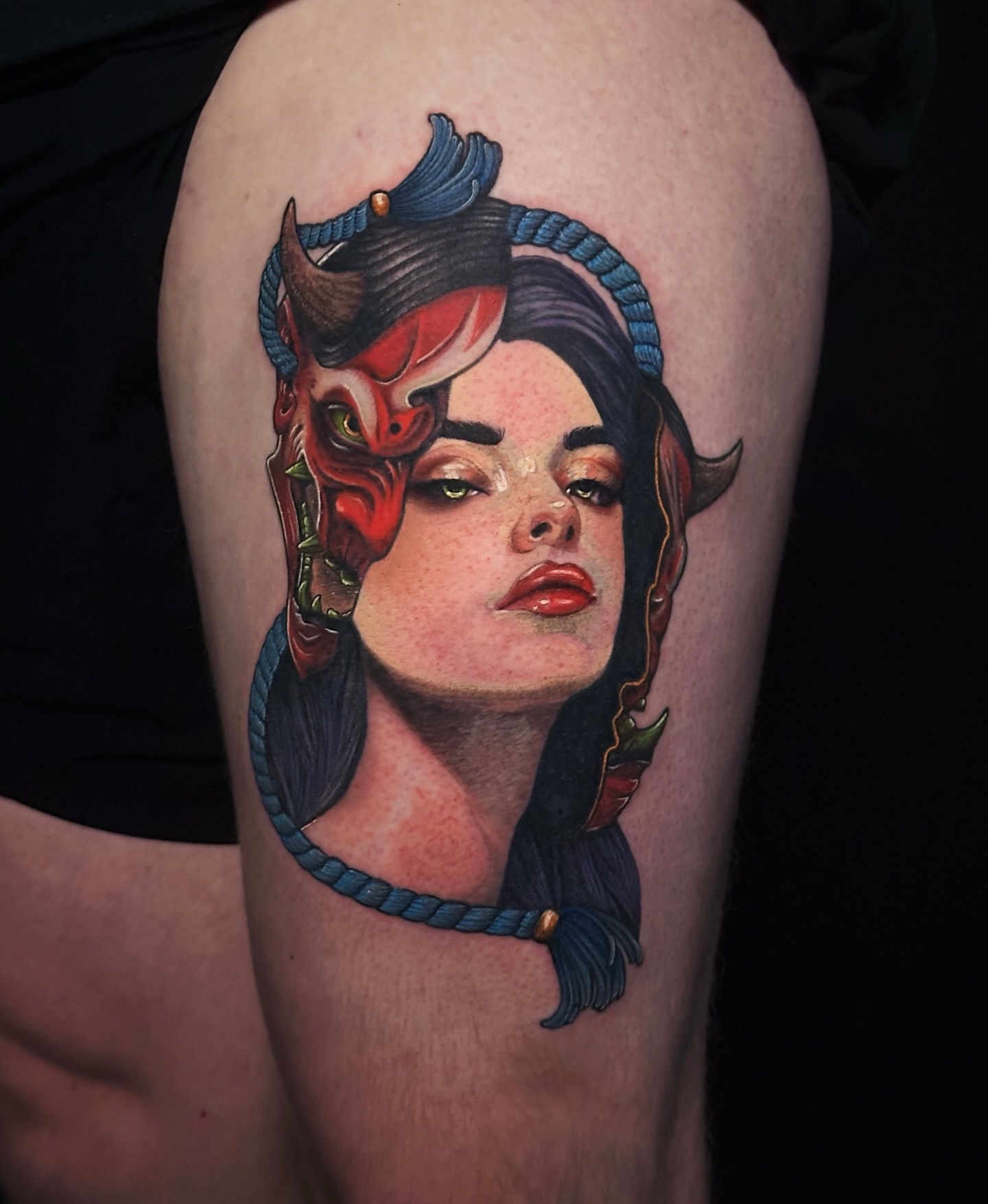 Woman with devil horns realism tattoo on the thigh by Kelsey Zussman
