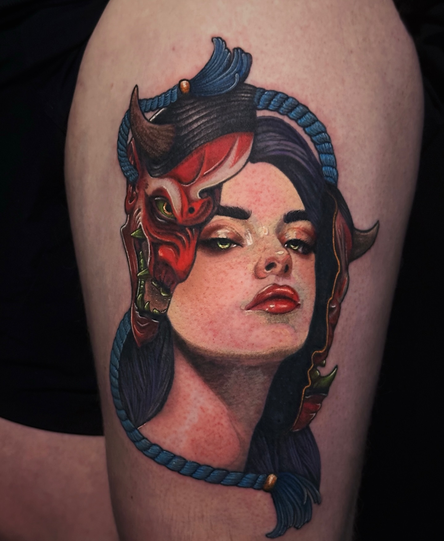 Woman with devil horns American traditional tattoo on the thigh by Kelsey Zussman