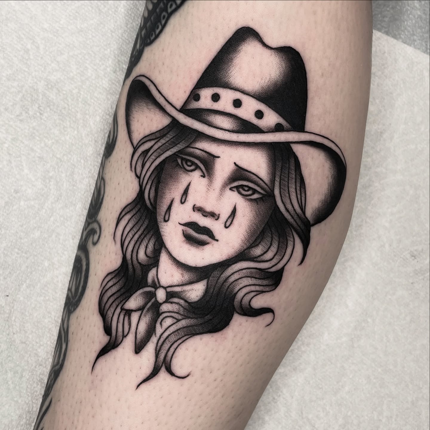 Cowgirl black and grey tattoo on the forearm by Dakota Jenner