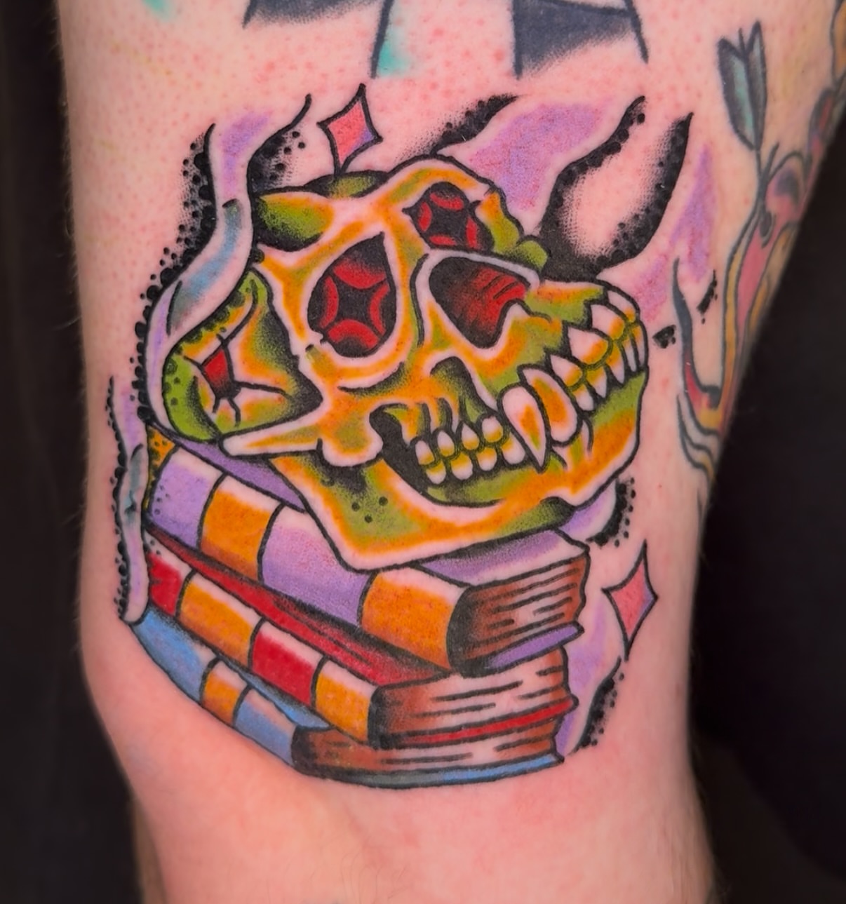 Skull and books American traditional tattoo on the forearm by πππ’π―π’π¨ πππΆπ©π¬π―π, Manchester, New Hampshire