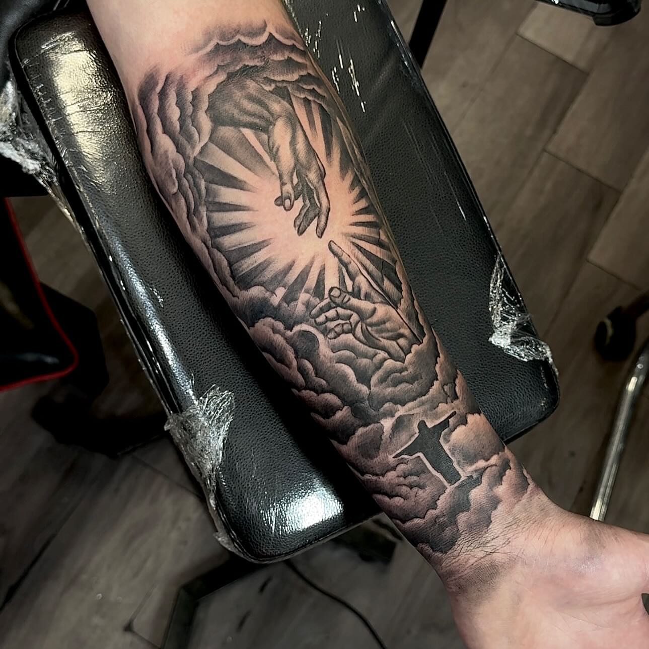 Religious ascension realism tattoo on the forearm by Tatt2T (T King)