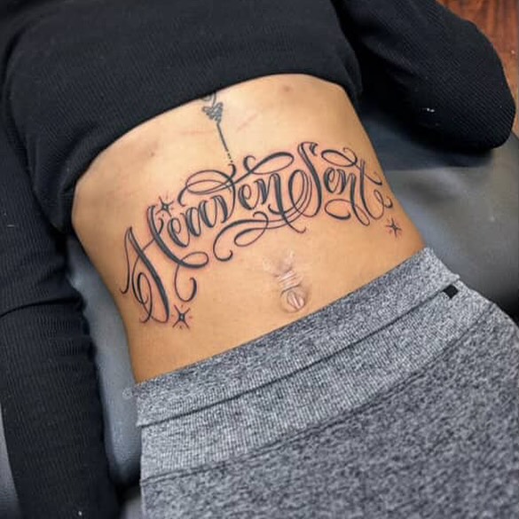 Heaven Sent lettering script tattoo on the ribs by $krypt