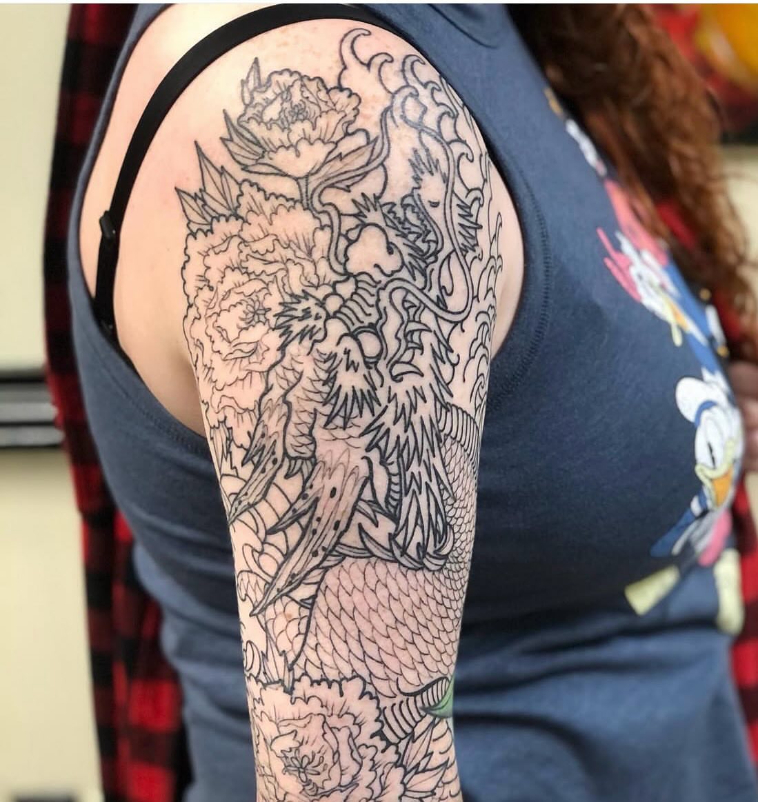Dragon and flowers japanese irezumi tattoo on the upper arm by Shayna Soderstrom, Columbus, Ohio