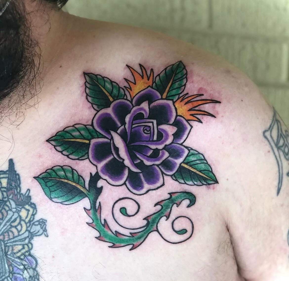 Purple rose American traditional tattoo on the shoulder by Shayna Soderstrom, Columbus, Ohio