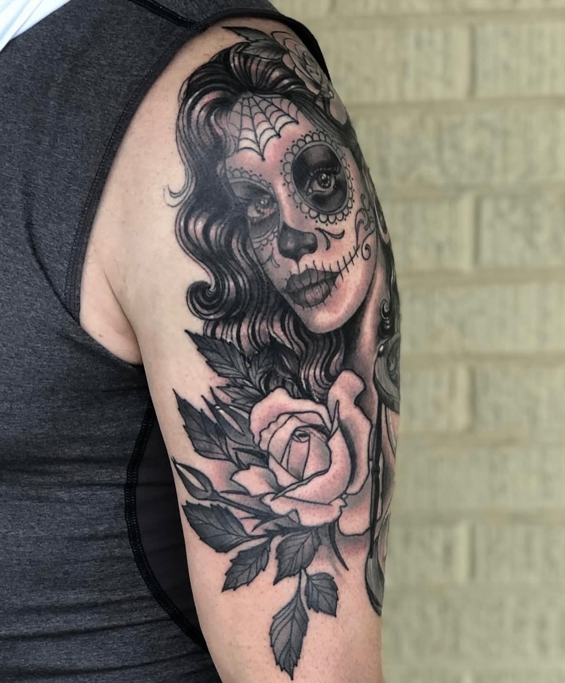 Sugar skull with rose realism tattoo on the shoulder by Shayna Soderstrom, Columbus, Ohio