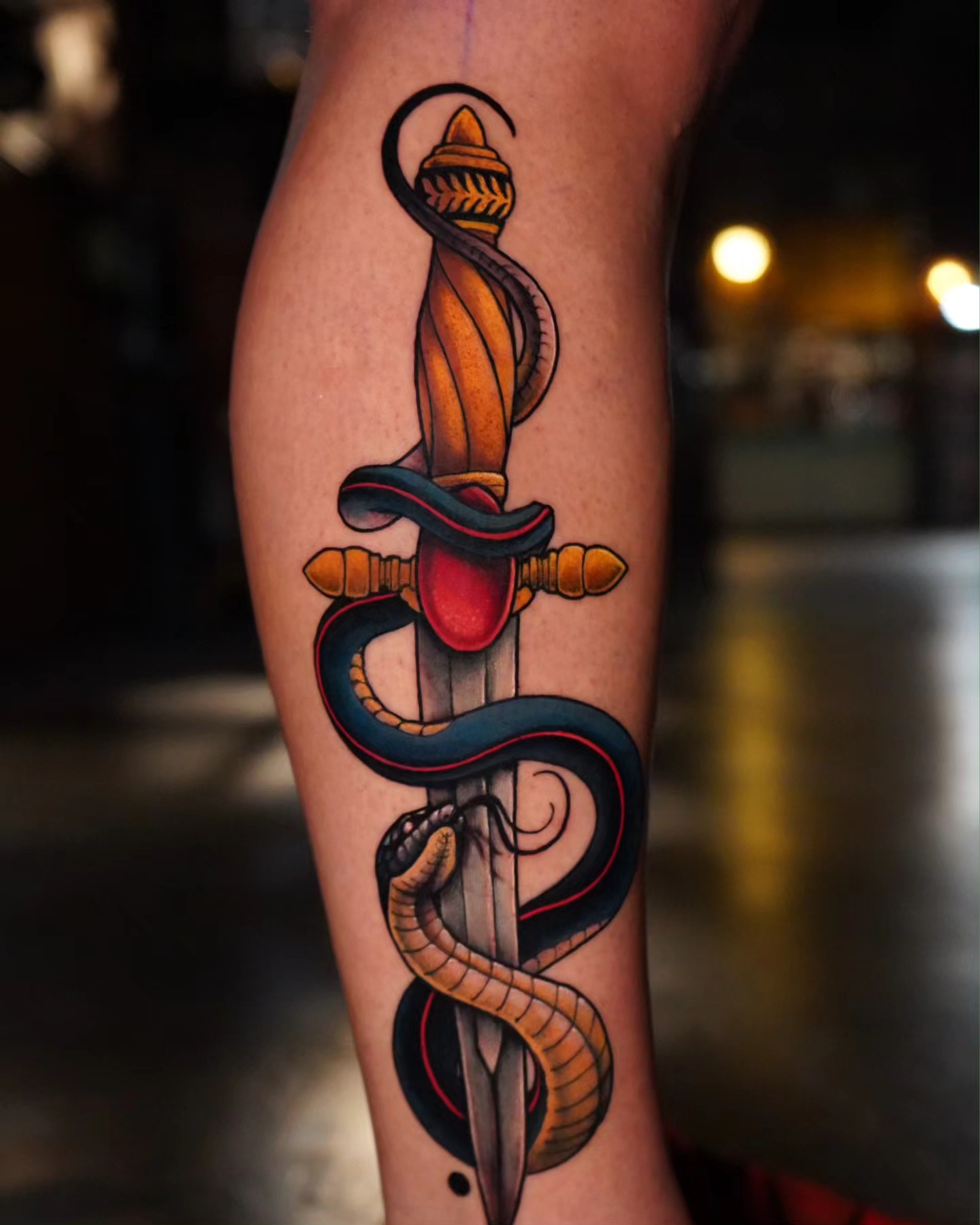 Snake and dagger American traditional tattoo on the forearm by Ashlynn Campbell