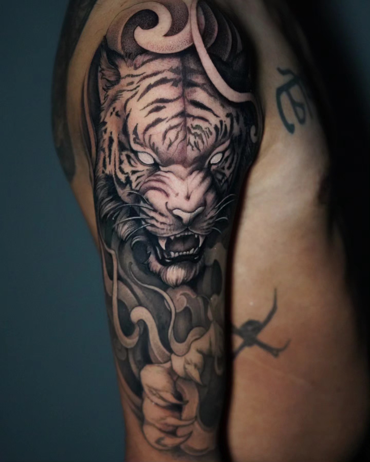 Tiger realism tattoo on the forearm by Ashlynn Campbell