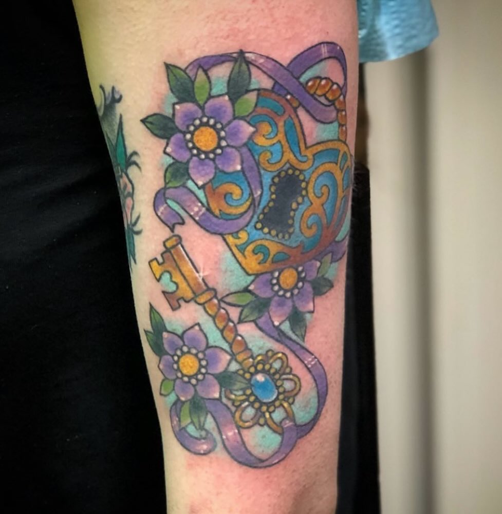 Key and floral design American traditional tattoo on the forearm by Shayna Soderstrom, Columbus, Ohio