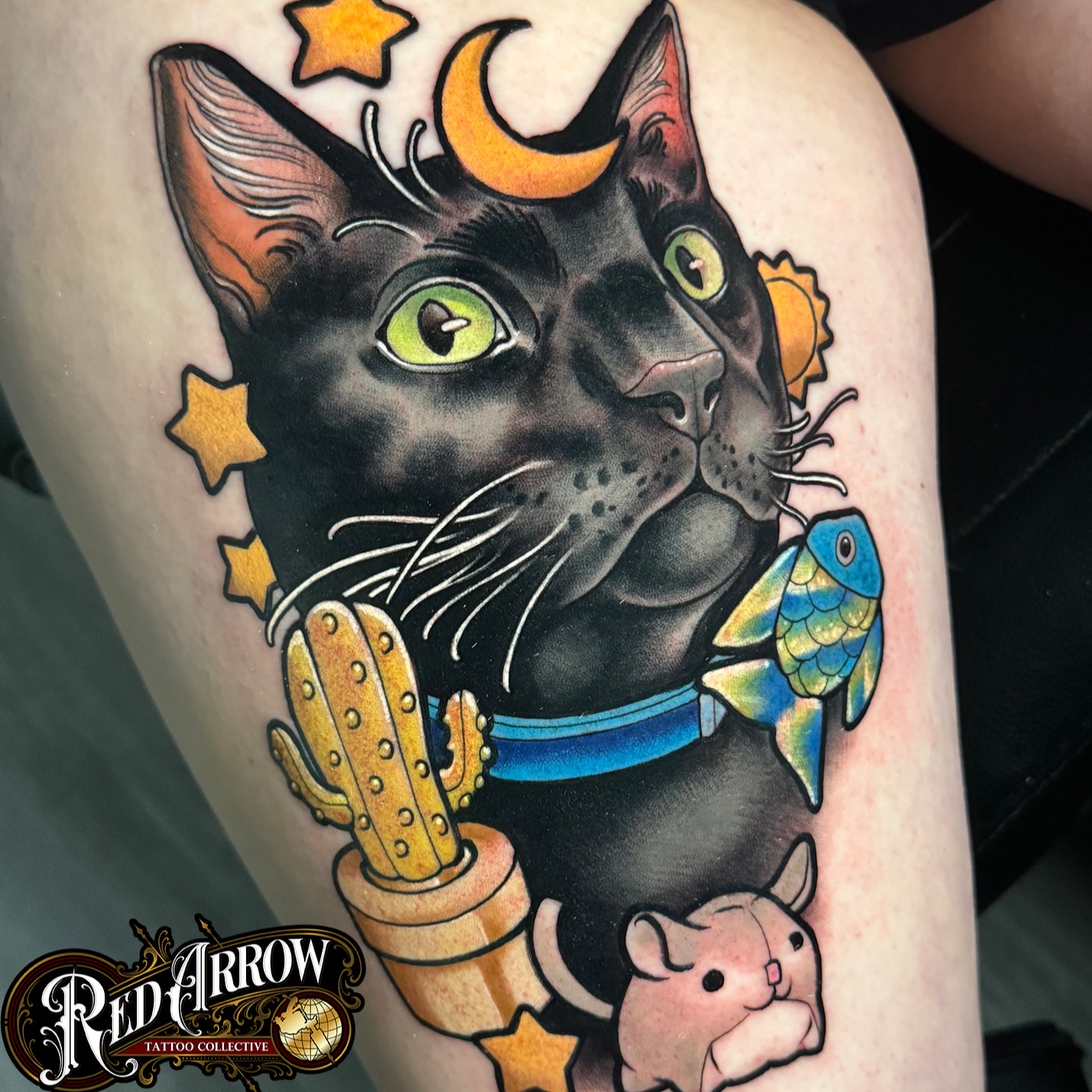 Cat with cactus and fish American traditional tattoo on the thigh by 𝕽𝖊𝖉 𝕬𝖗𝖗𝖔𝖜 𝕿𝖆𝖙𝖙𝖔𝖔 𝕮𝖔𝖑𝖑𝖊𝖈𝖙𝖎𝖛𝖊, Troy, Michigan