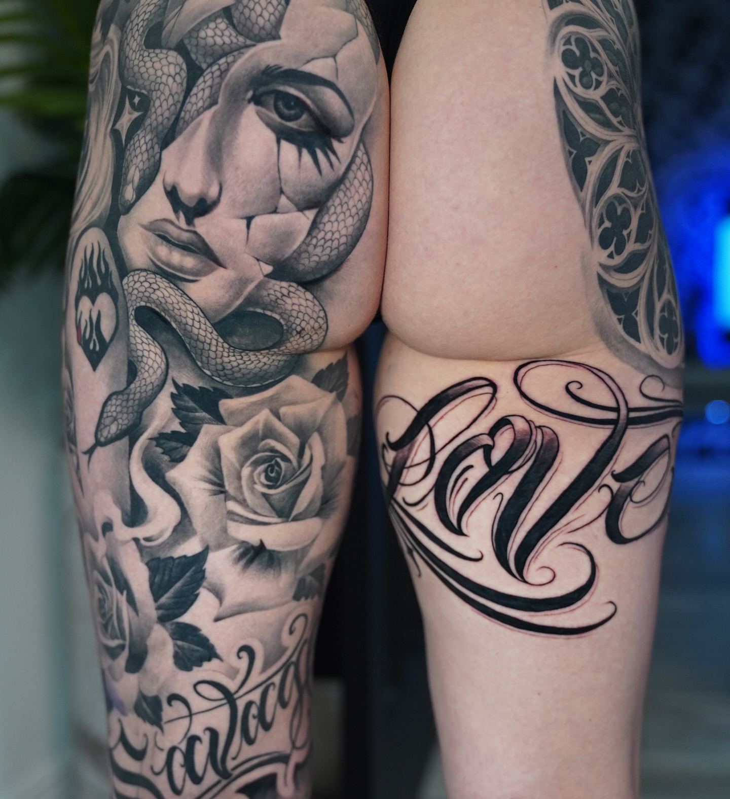 Woman with snake and rose American traditional tattoo on the forearm by Artem Kunakuzin