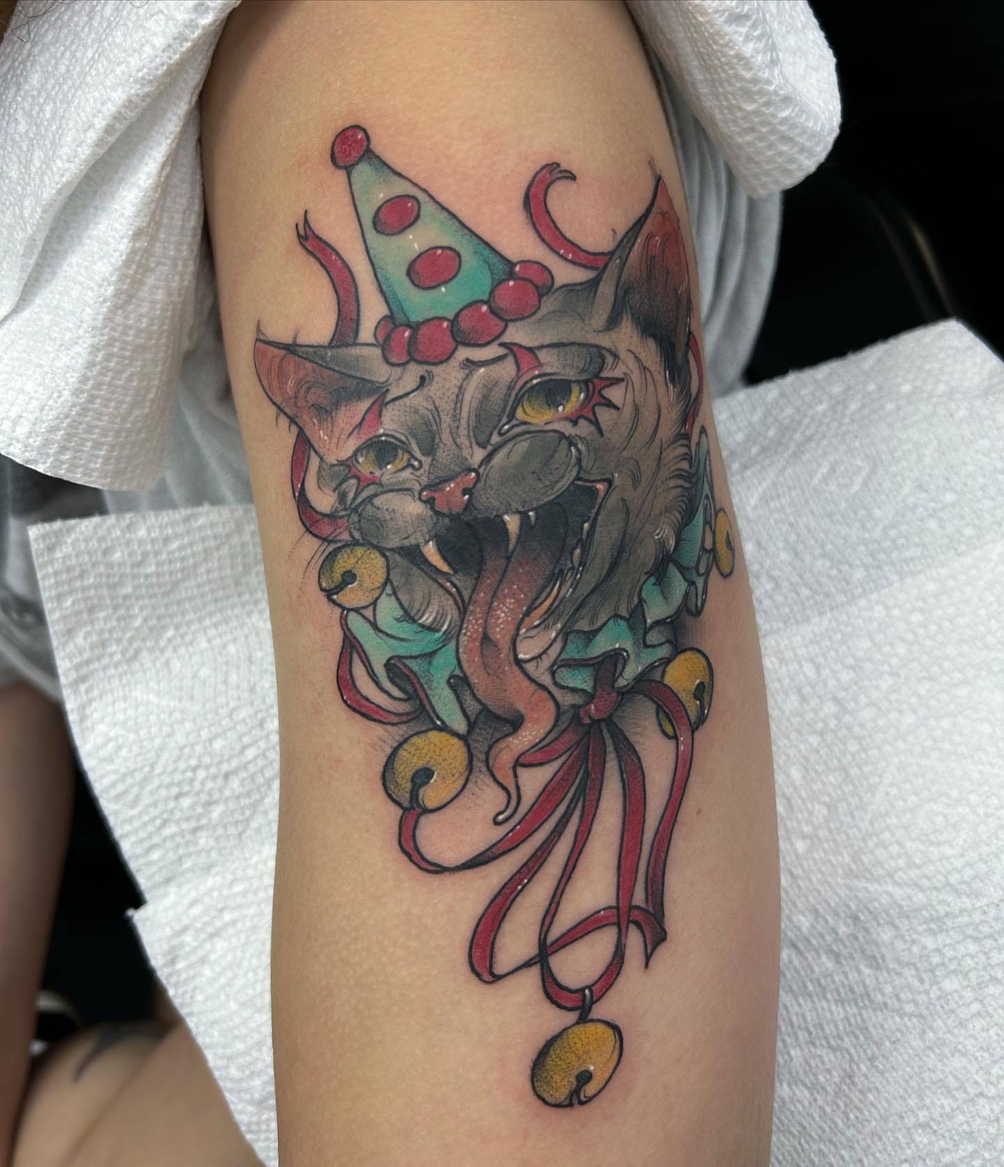 Cat with clown hat American traditional tattoo on the forearm by Tatijana., Kettering, Ohio