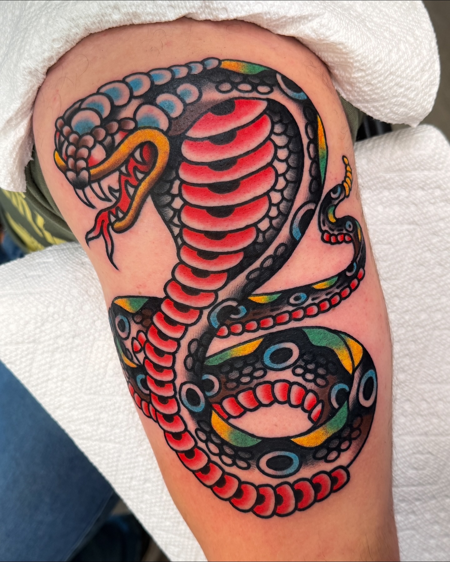 Snake American traditional tattoo on the thigh by Cullen Bleser Quinn