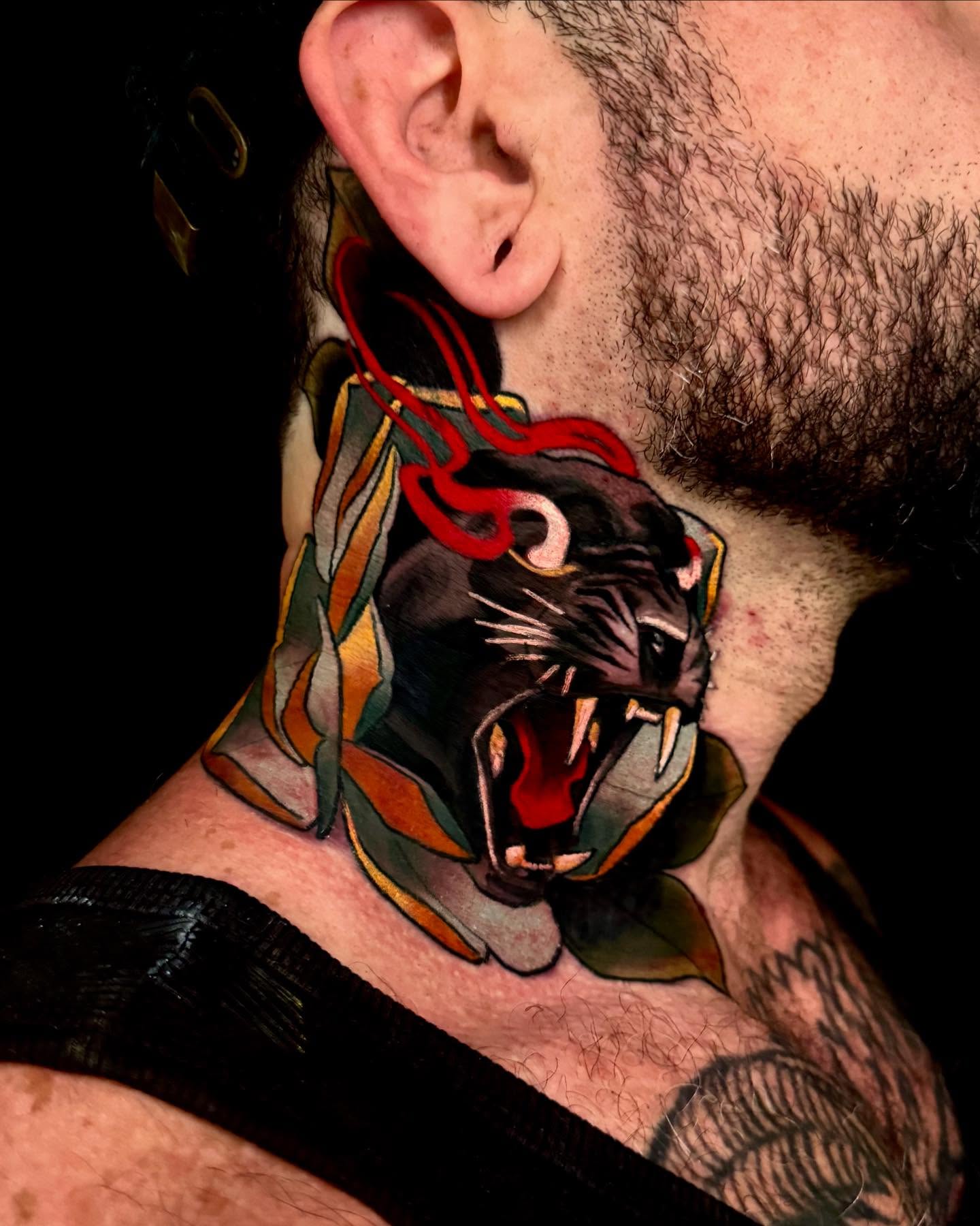 Roaring panther American traditional tattoo on the neck by Sweets, Nashville, Tennessee